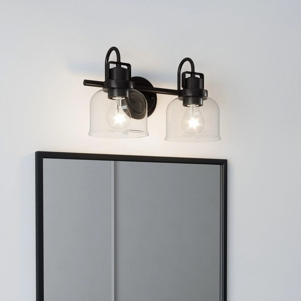 2-light vanity wall sconce with oil-rubbed bronze hardware and clear glass shades
