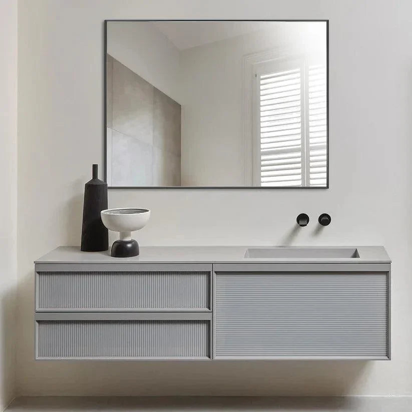 Black aluminum framed wall mirror, rectangular with sleek frame and reflective glass.