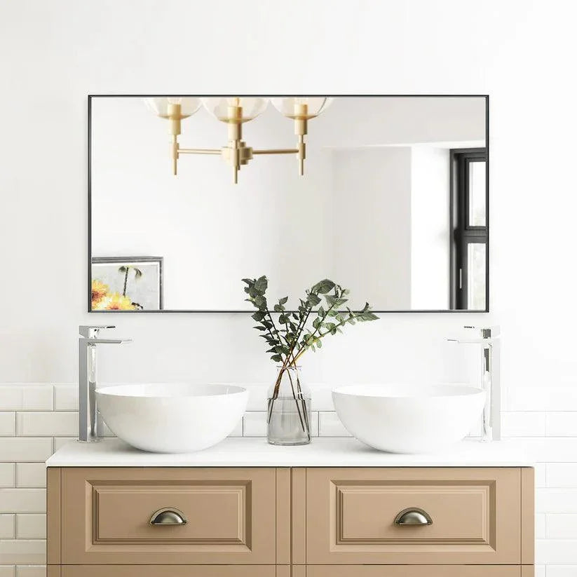 Black aluminum framed wall mirror with wide rectangular reflective surface.