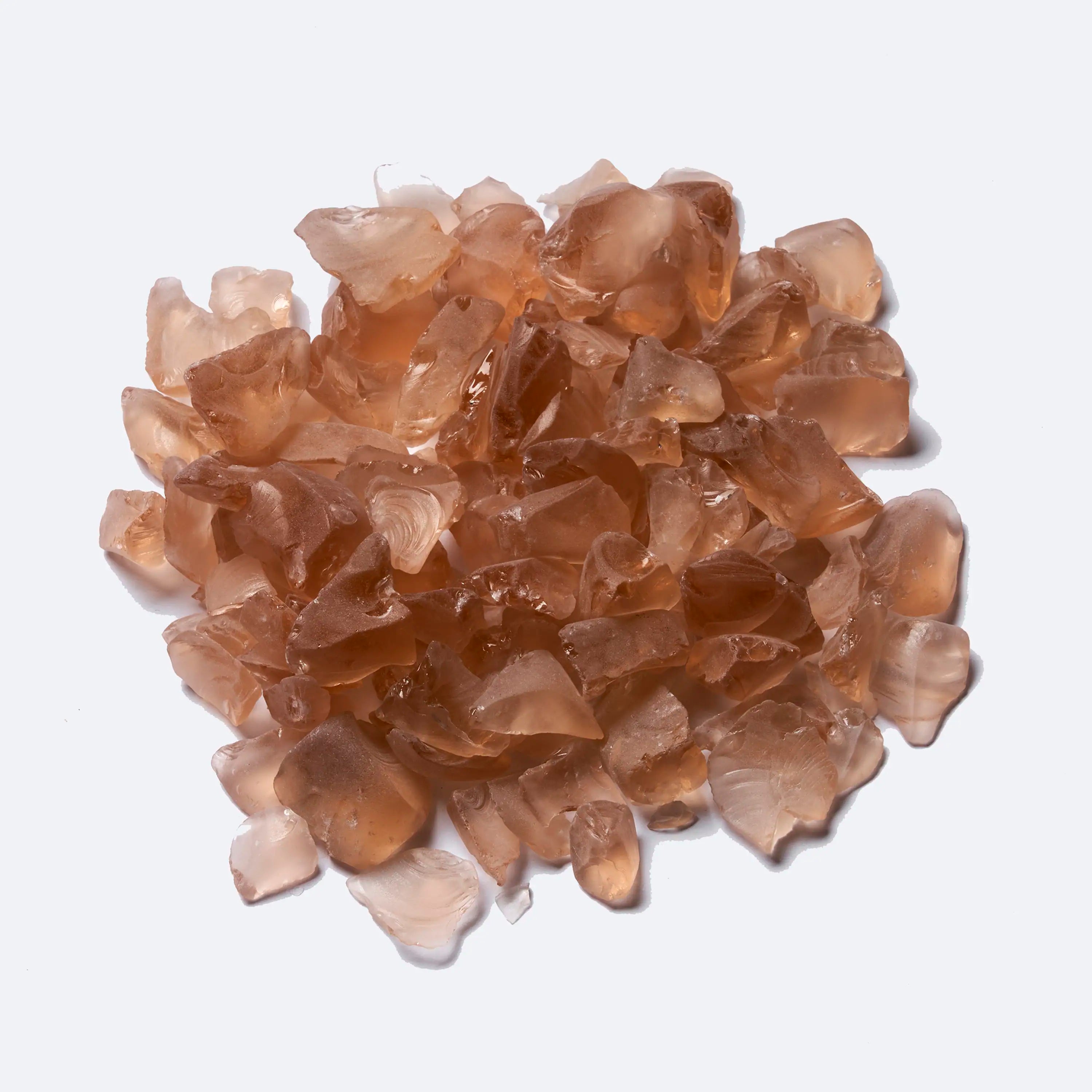 Electric fireplace fuel bed pieces, translucent amber-toned stones