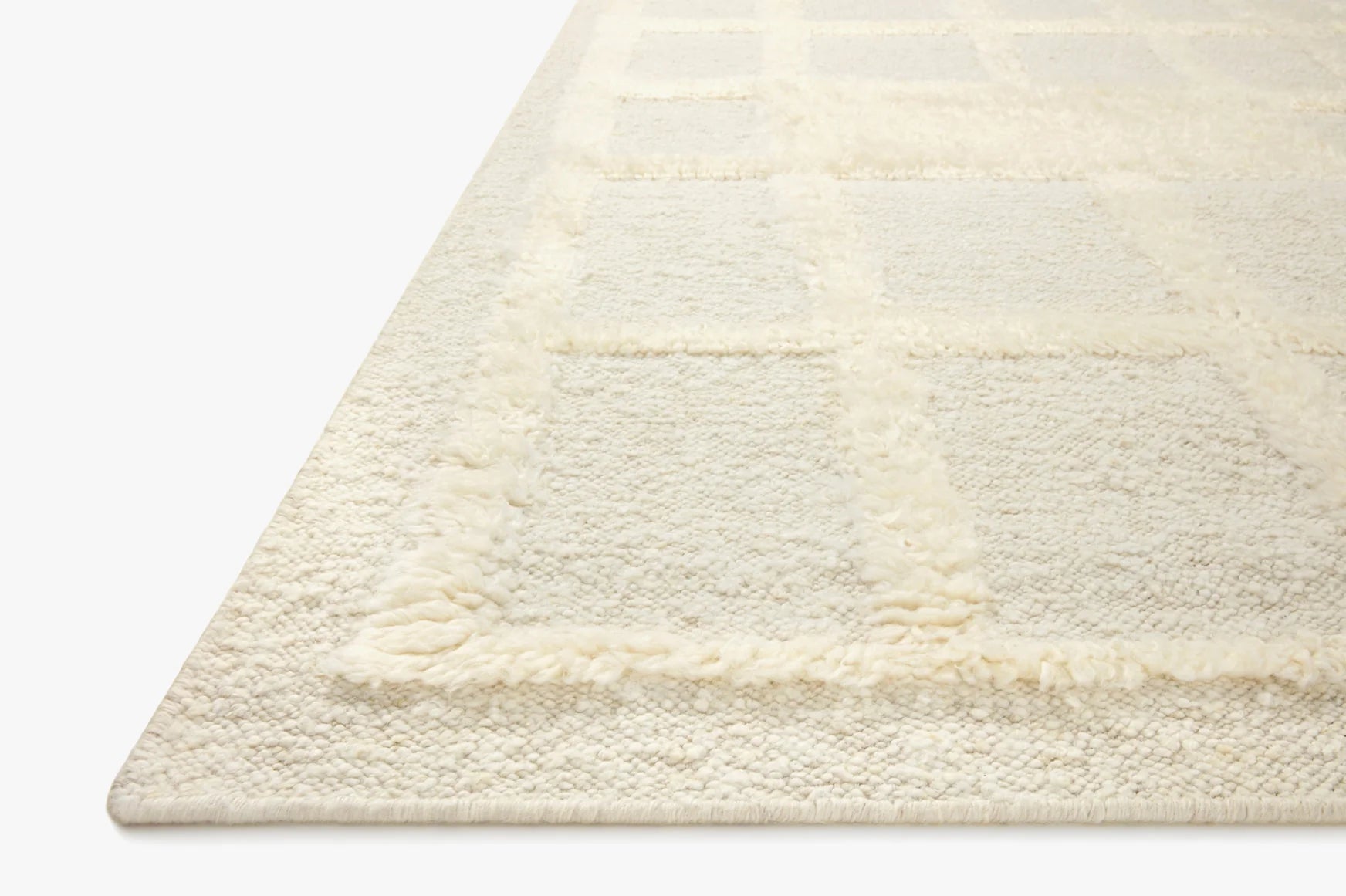 Ivory area rug with plush shag pile and subtle raised stripe pattern
