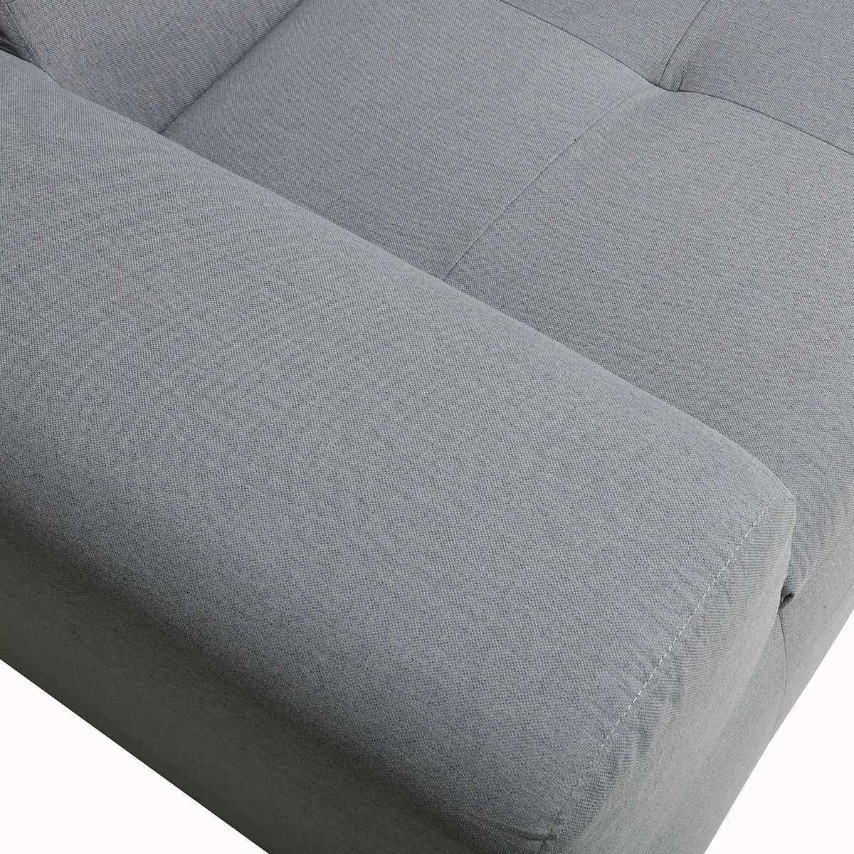 Gray upholstered seat and arm cushion with textured fabric weave and stitched seams