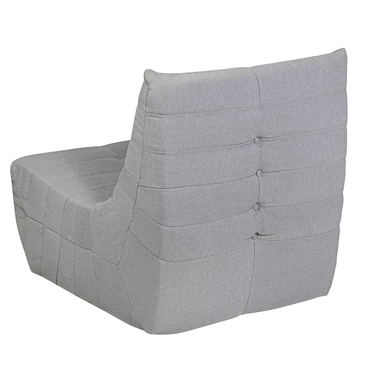 Gray compressed foam lounge chair with tall tufted back and wide curved armrests.