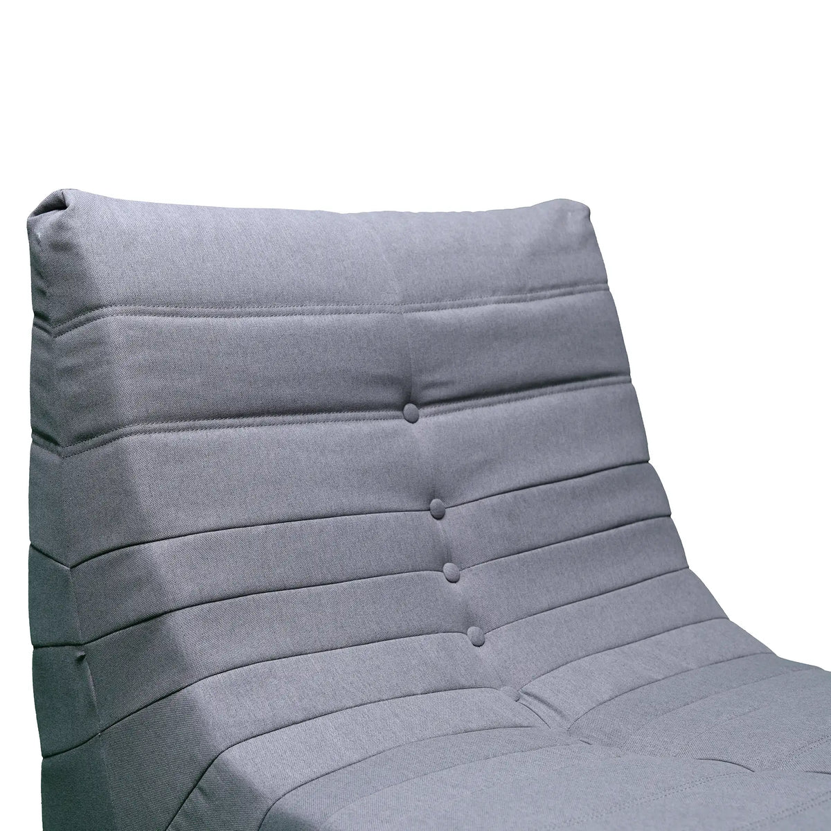 Gray compressed foam chair with tufted backrest, smooth seat panel, and stitched seams.