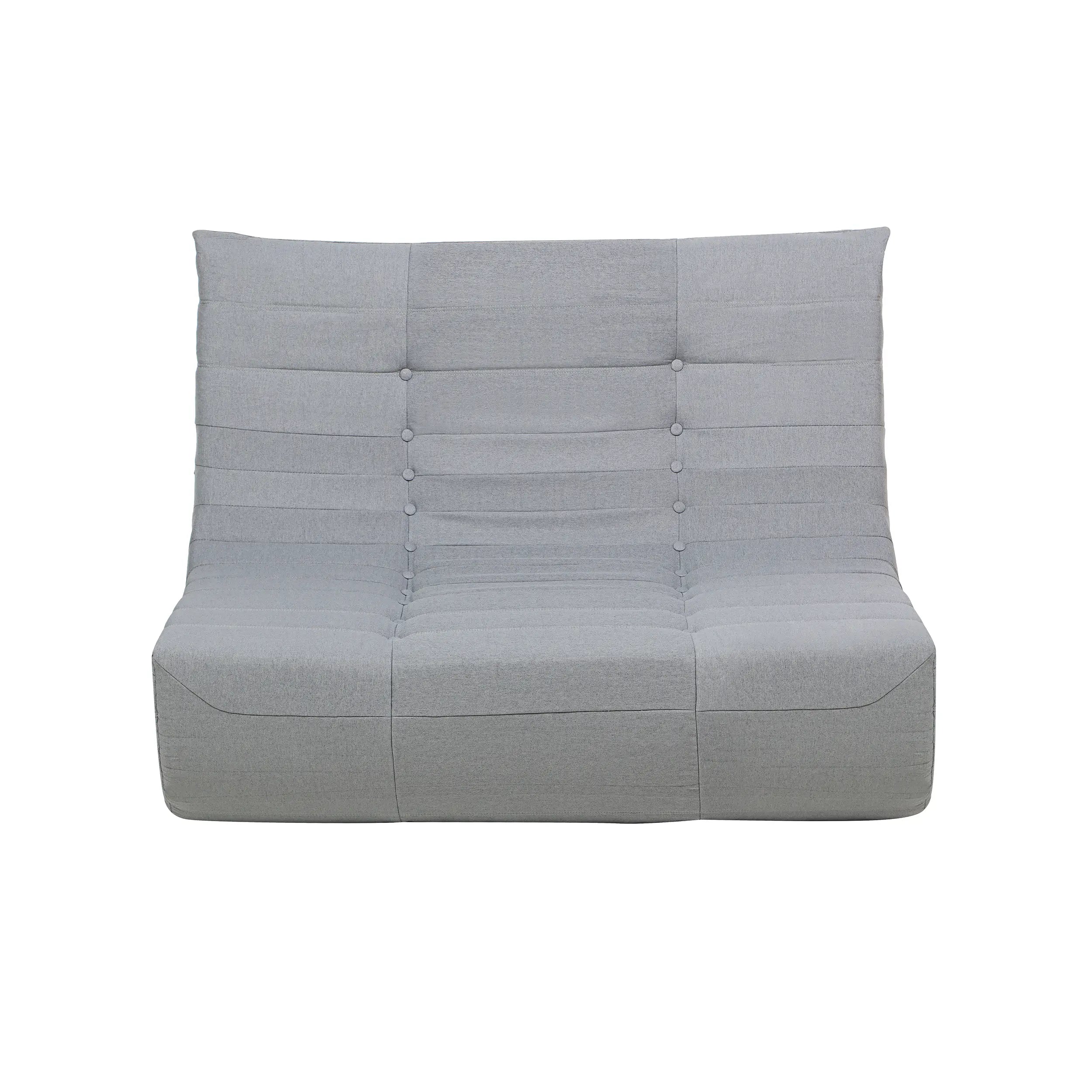 Gray compressed foam sofa with tufted backrest and cushioned seat