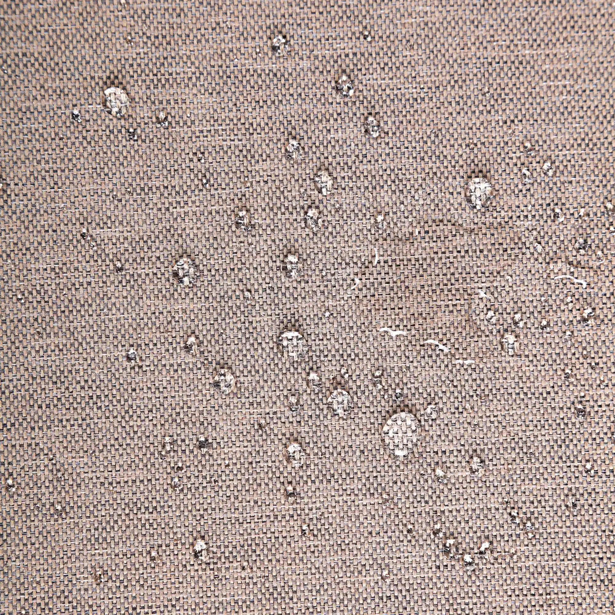 Tan compressed foam sofa fabric texture close-up