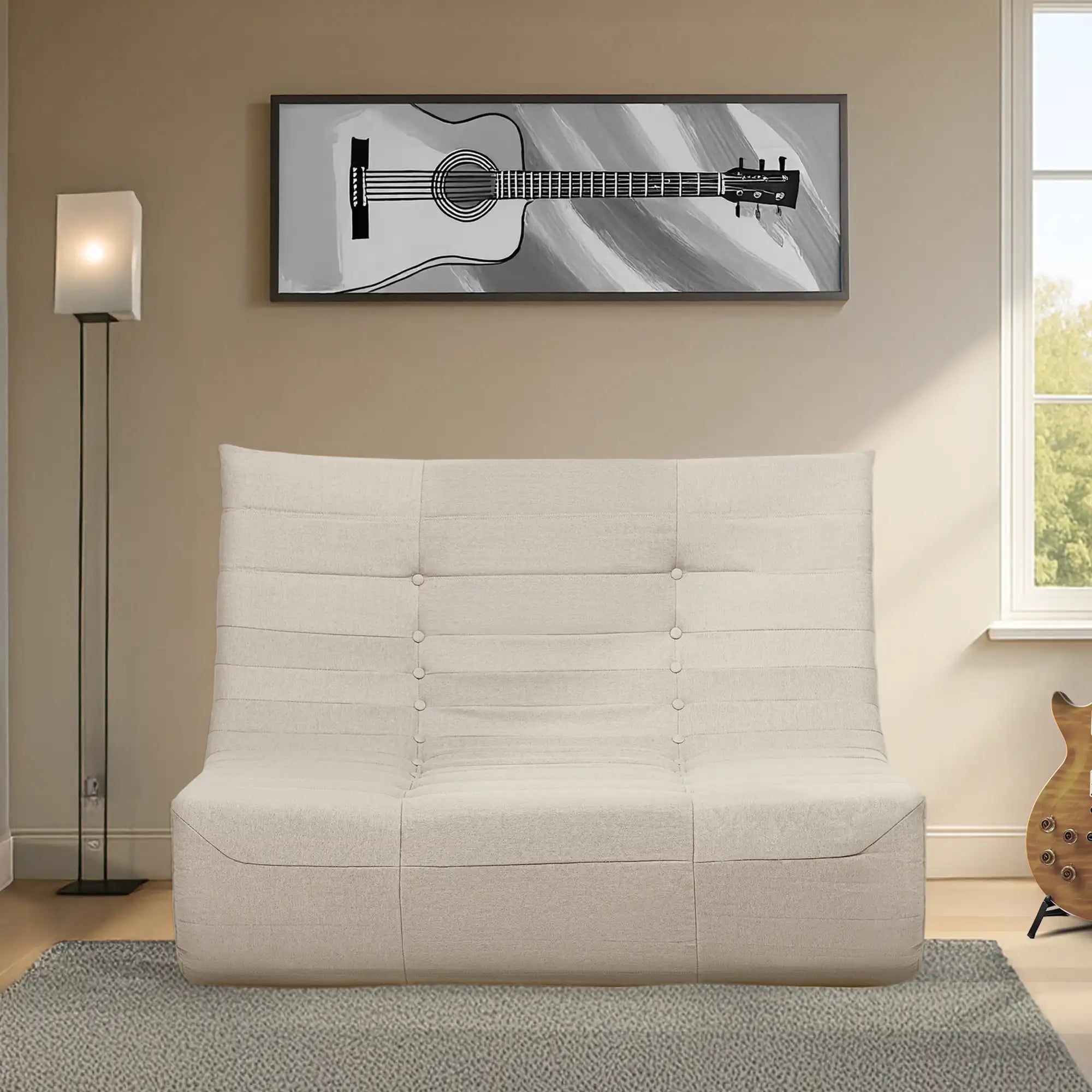 Beige compressed-foam sofa bed with tufted button center and padded back.