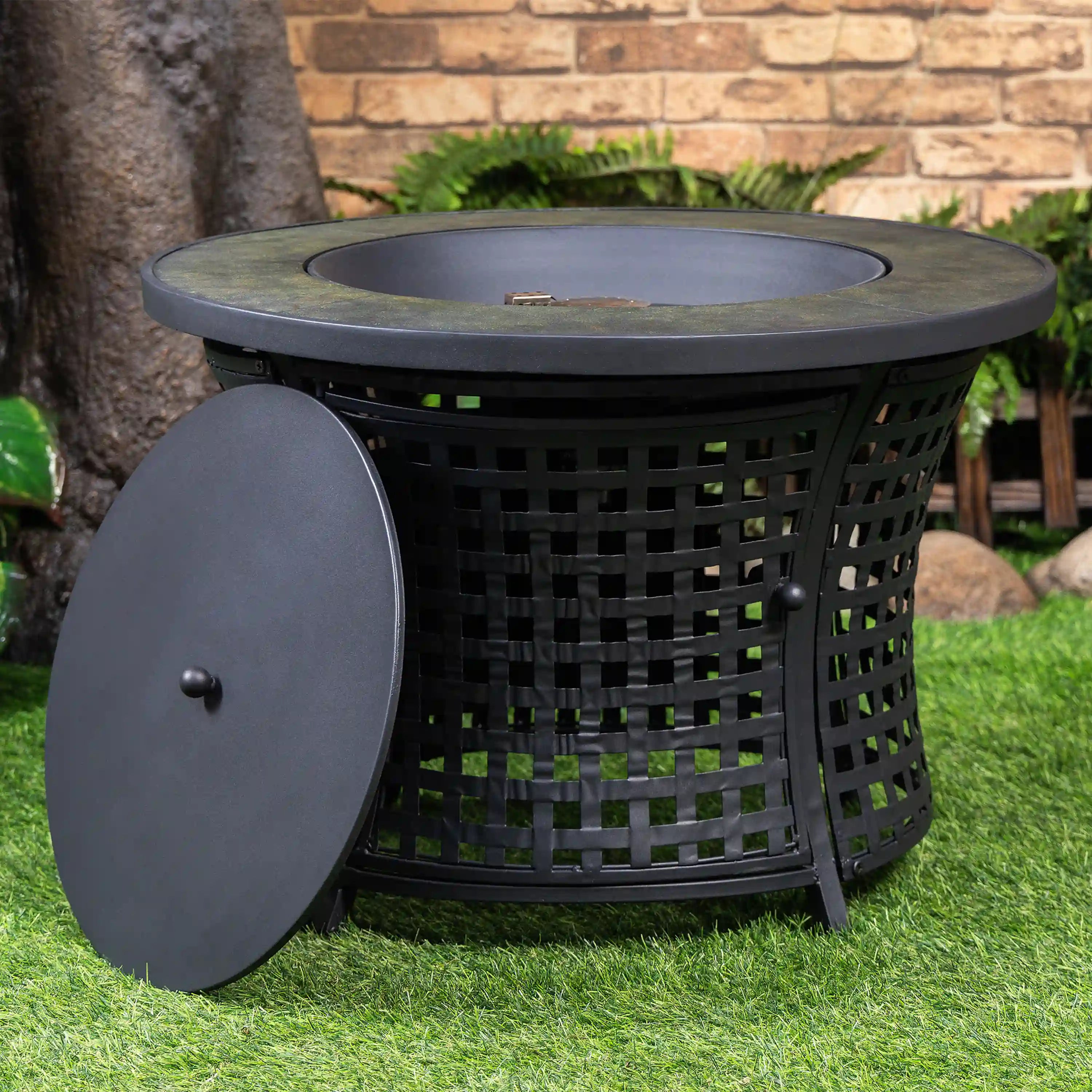 Round black propane fire pit table with front side panel open, lattice fire bowl