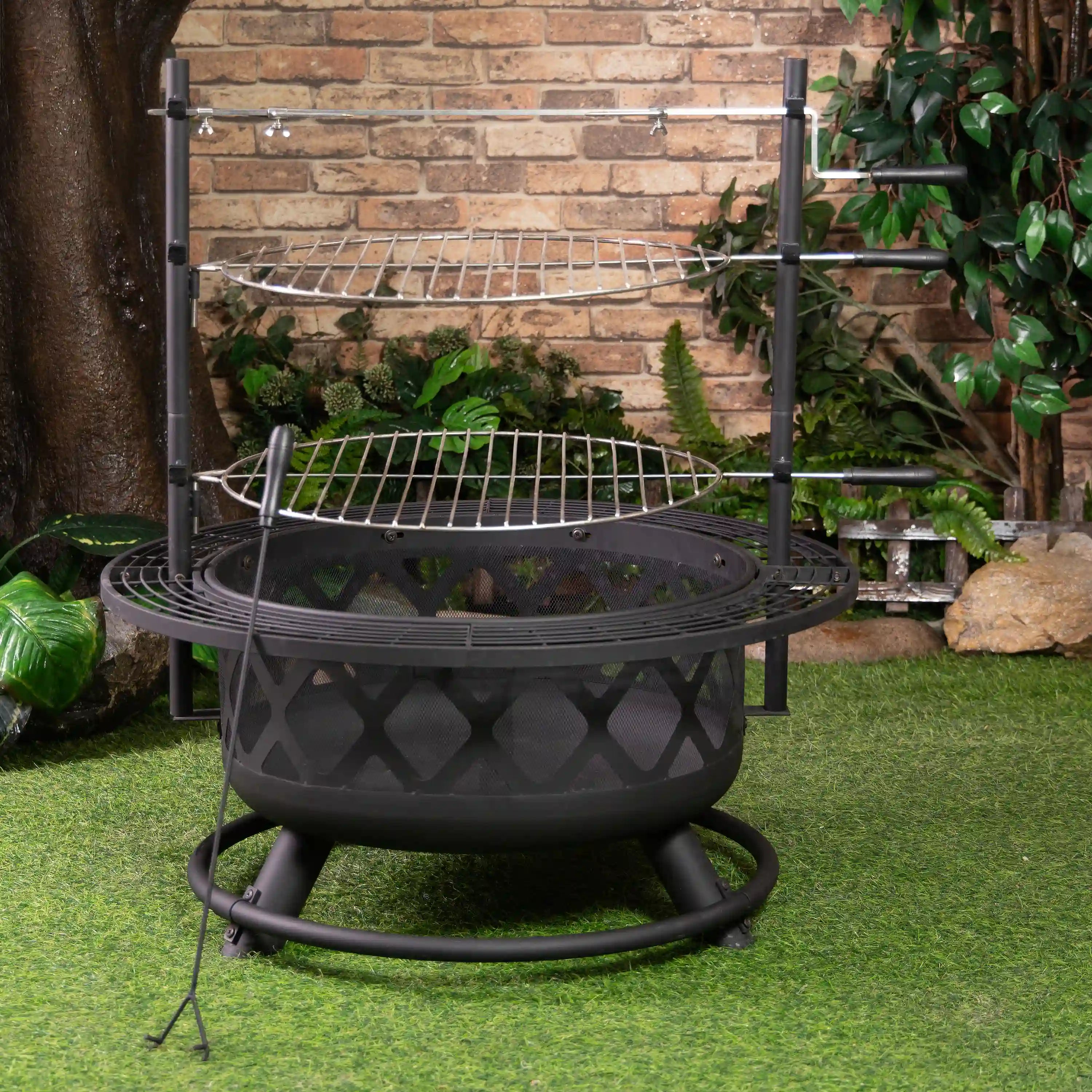Black outdoor fire pit grill with round bowl, top grate, and support legs