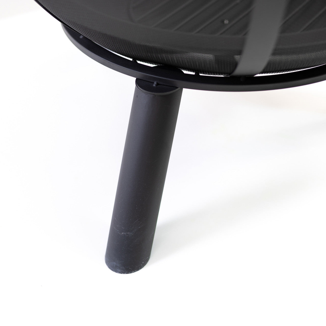 Black metal leg and base of a sphere outdoor fire pit with mesh screen dome