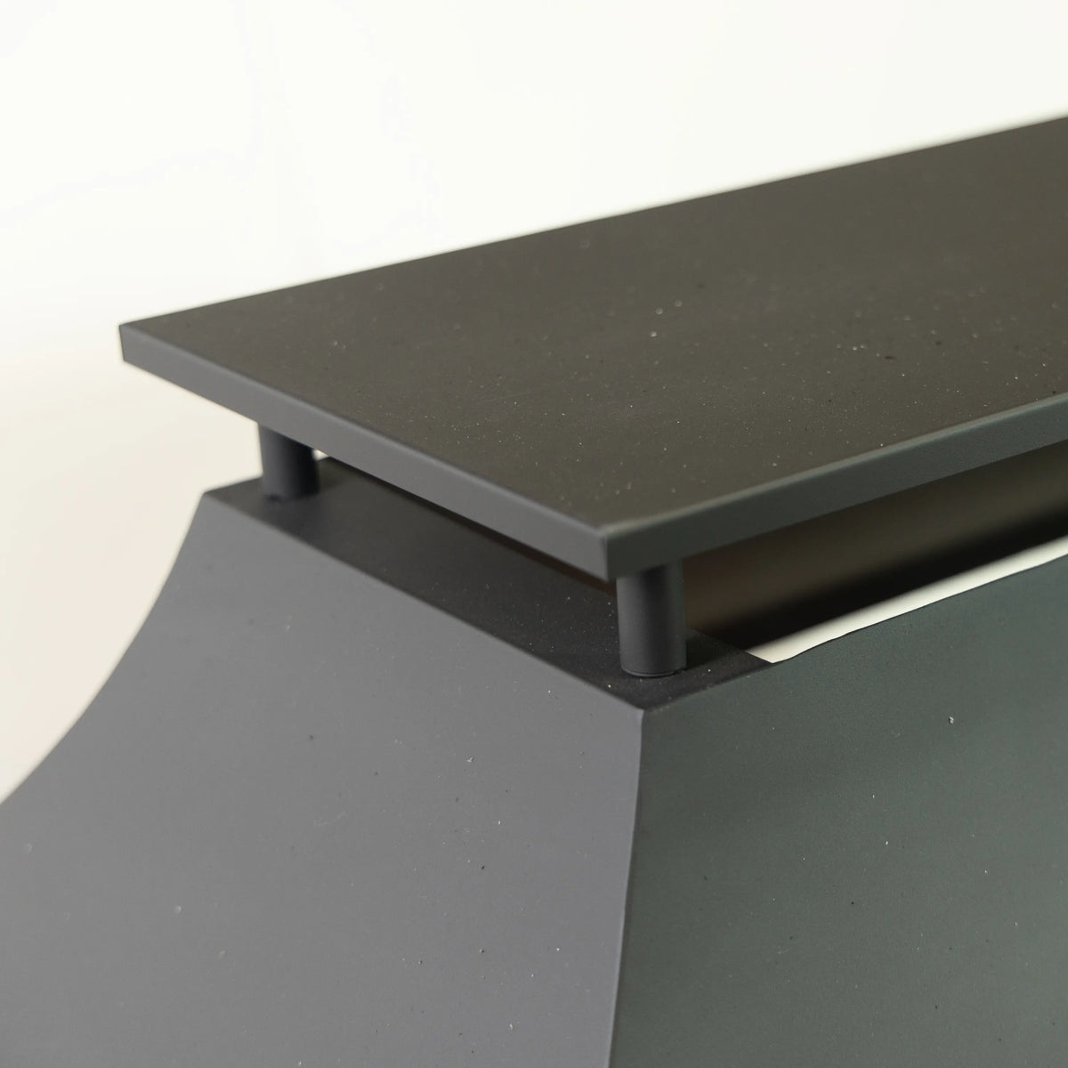 Outdoor steel fireplace top and side panel in dark charcoal finish