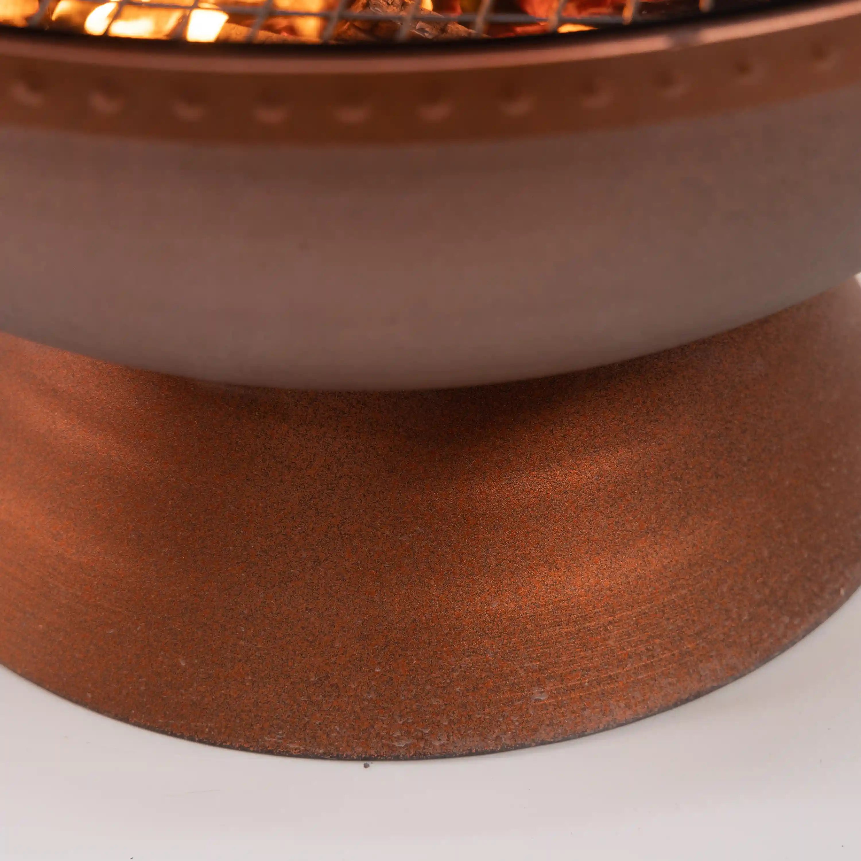 Round firepit bowl rim with textured metal finish, no flames visible