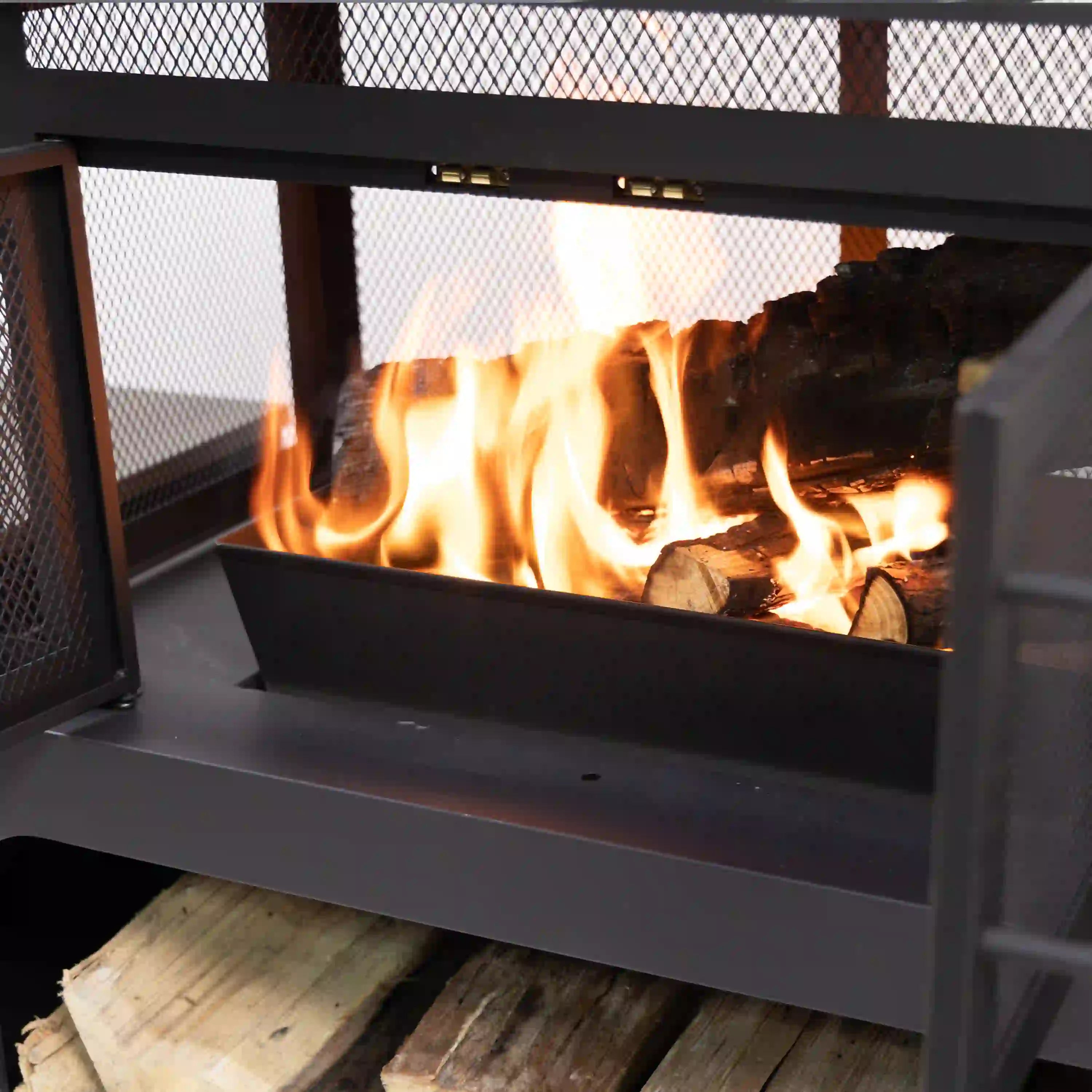 Wood-burning fireplace interior with steady flames and burning logs in firebox