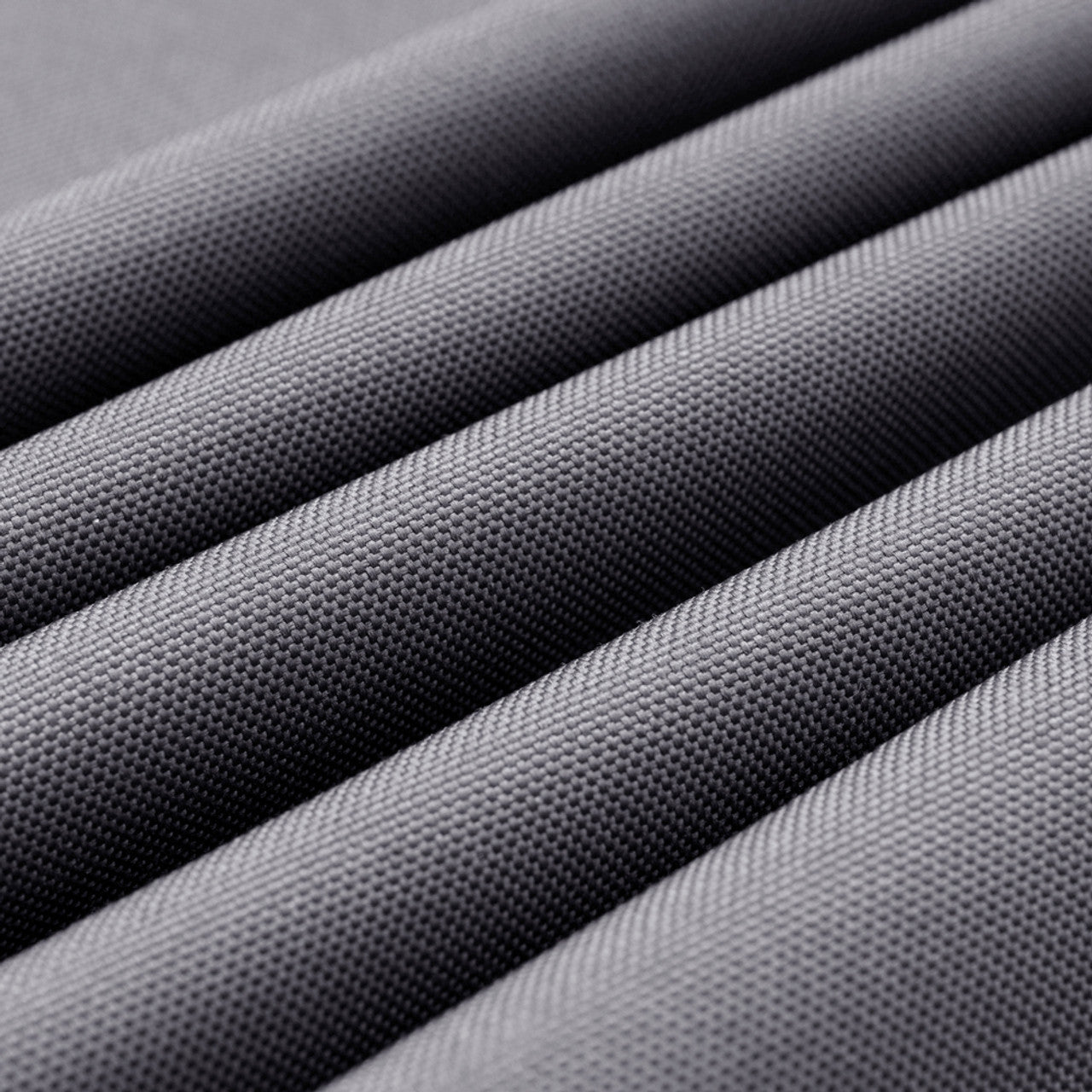 Textured outdoor chair fabric in dark gray, close-up