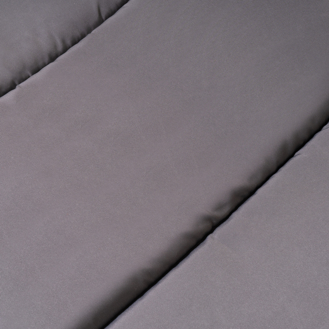 Padded outdoor cushion surface, smooth dark gray fabric
