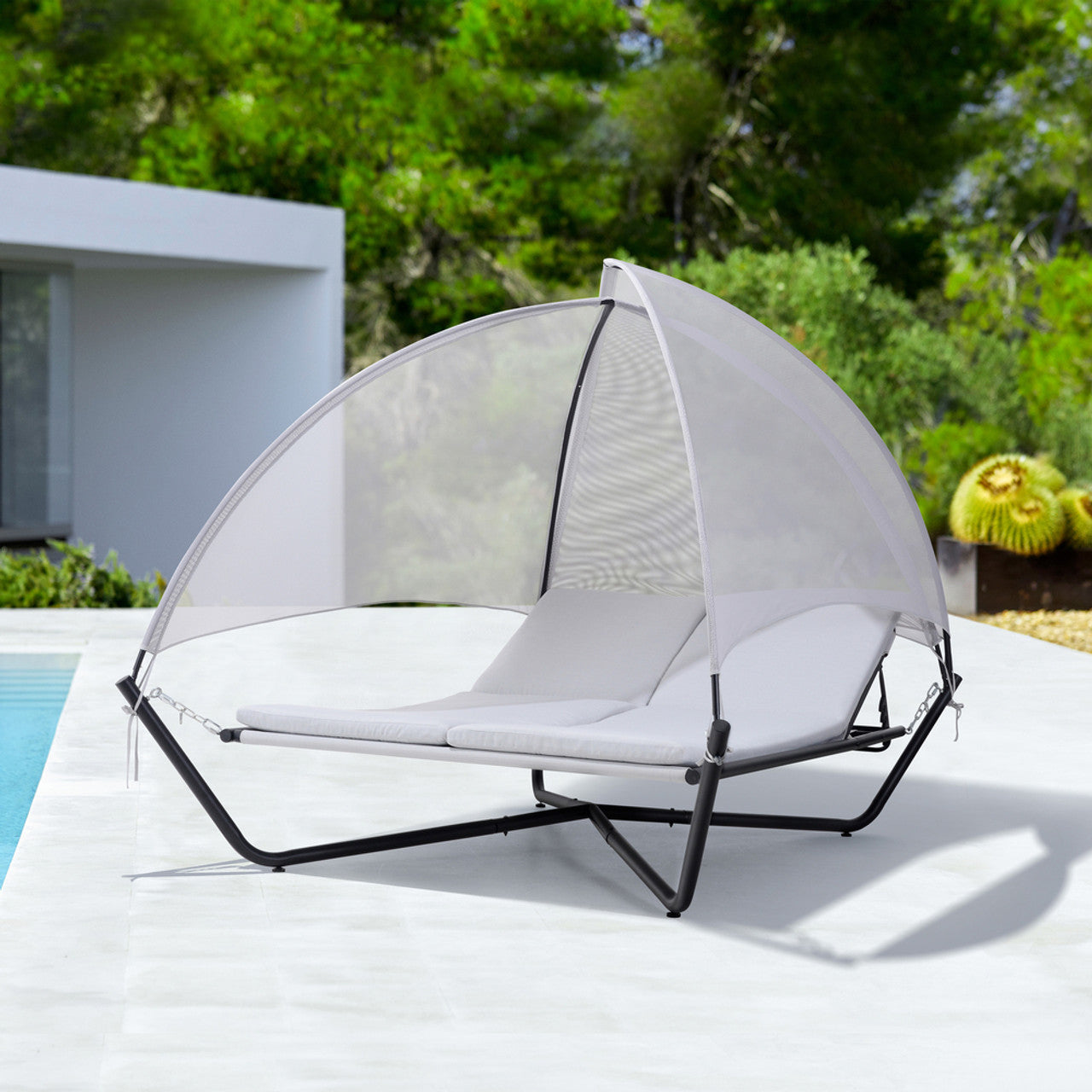 Outdoor hammock daybed lounge with canopy and light gray seat cushions on black frame