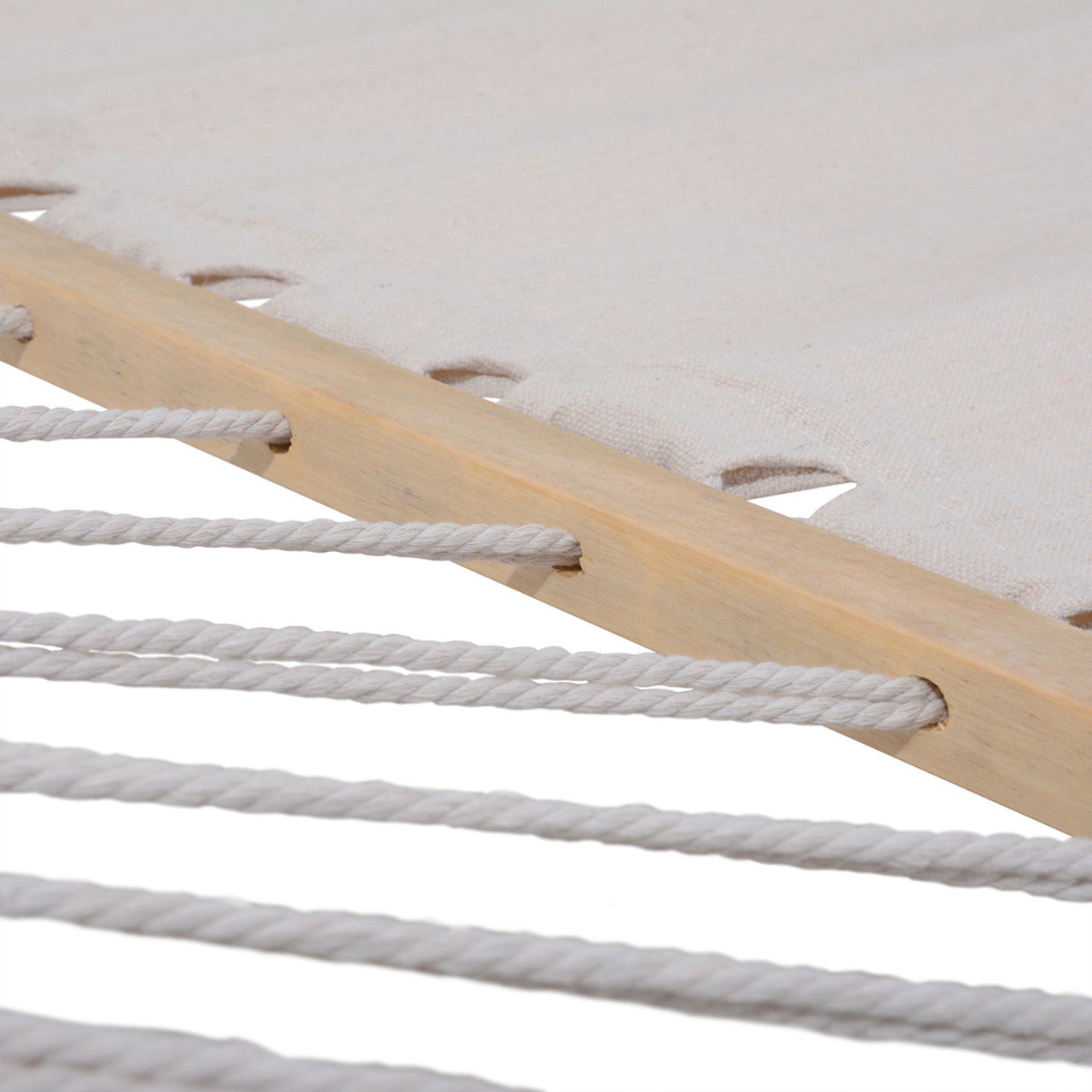 Close-up of white woven hammock fabric with wooden spreader bar and rope ties