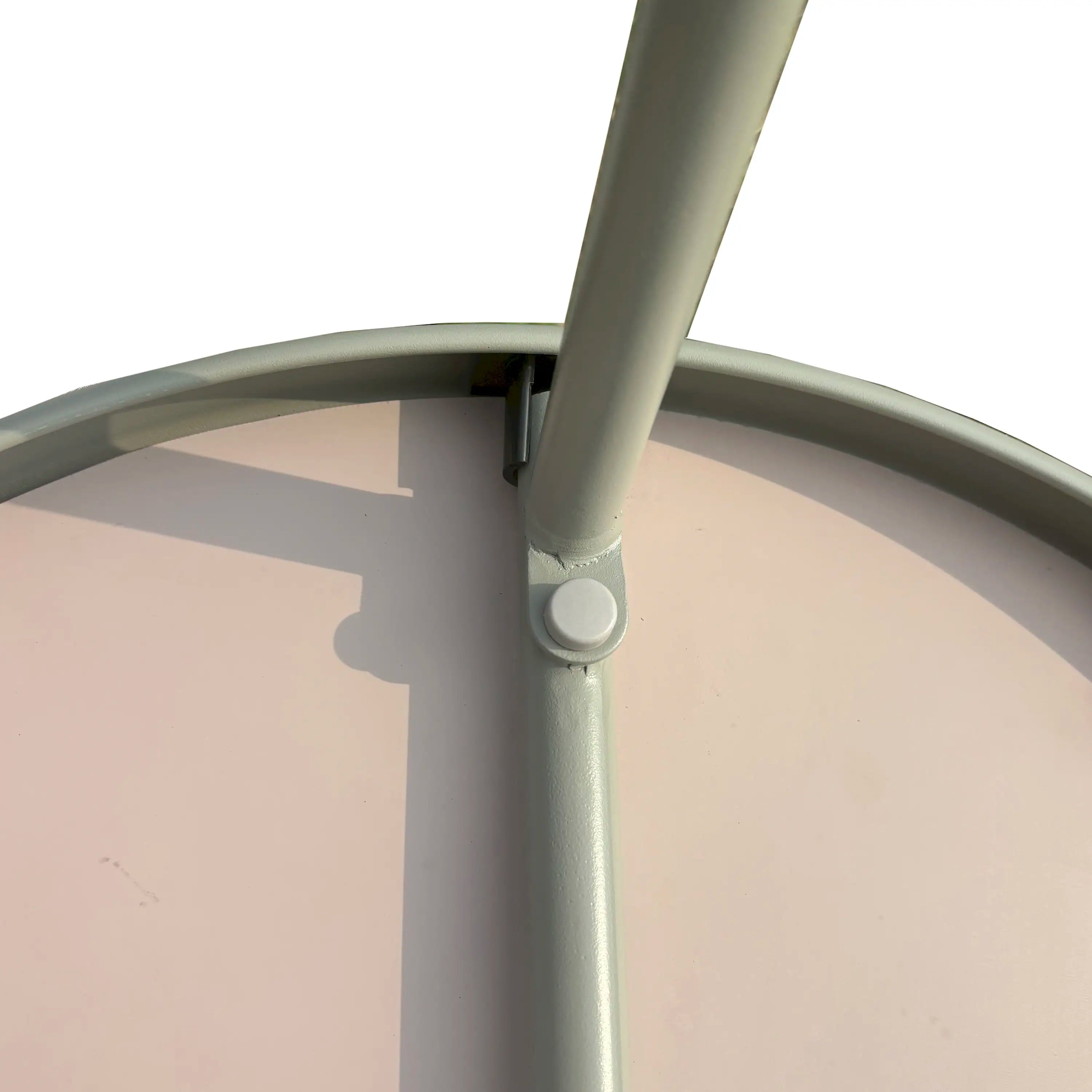 Round coffee table underside with light gray frame and round support joint