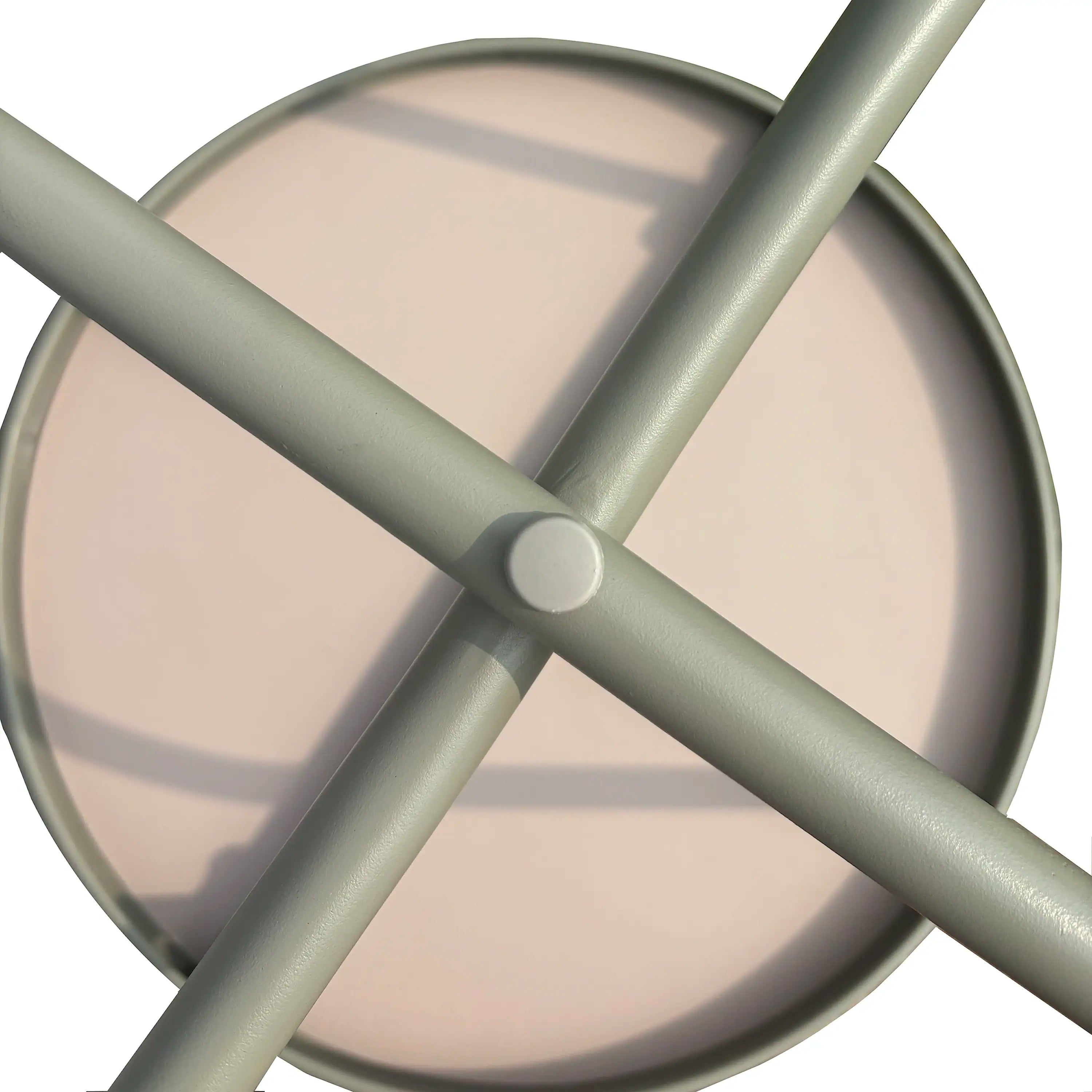 Round coffee table with light gray round top and crossbar metal base