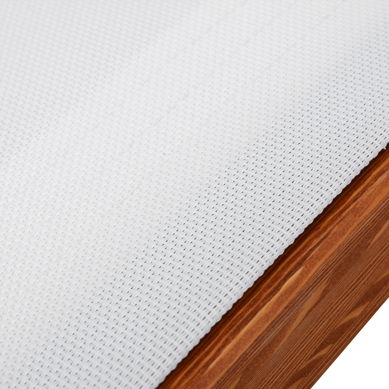 White Textilene sling fabric with woven texture on cedar wood lounge chair, close-up