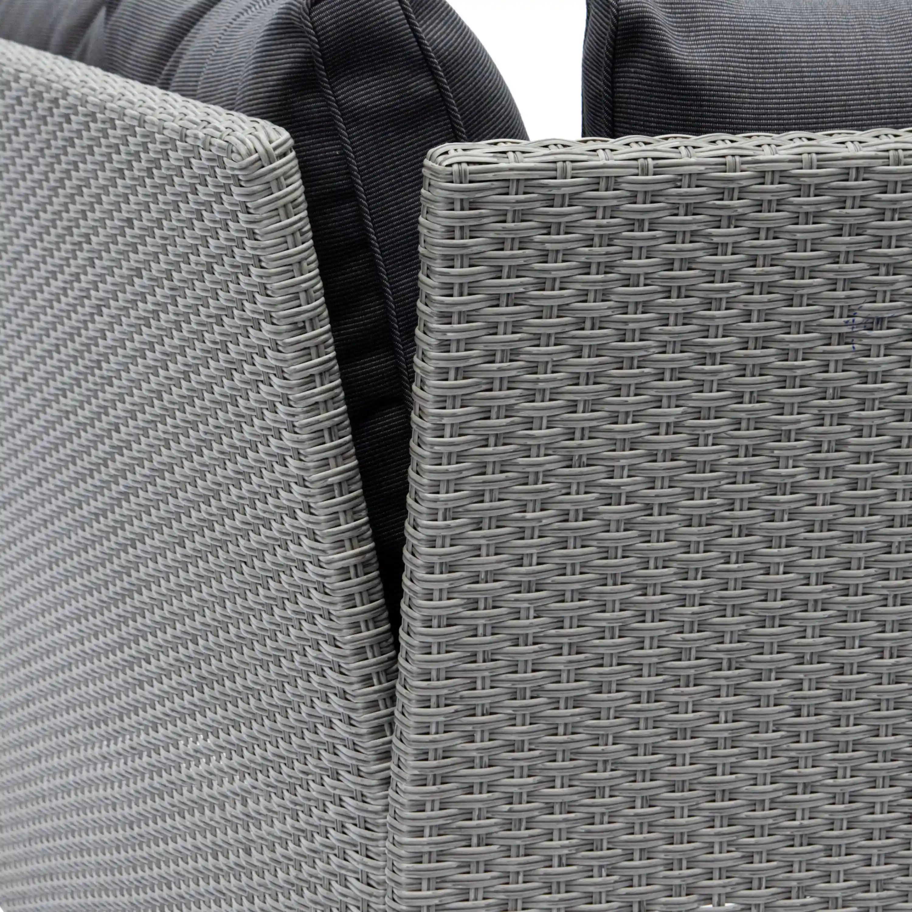 Close-up of gray woven wicker texture and dark cushion trim