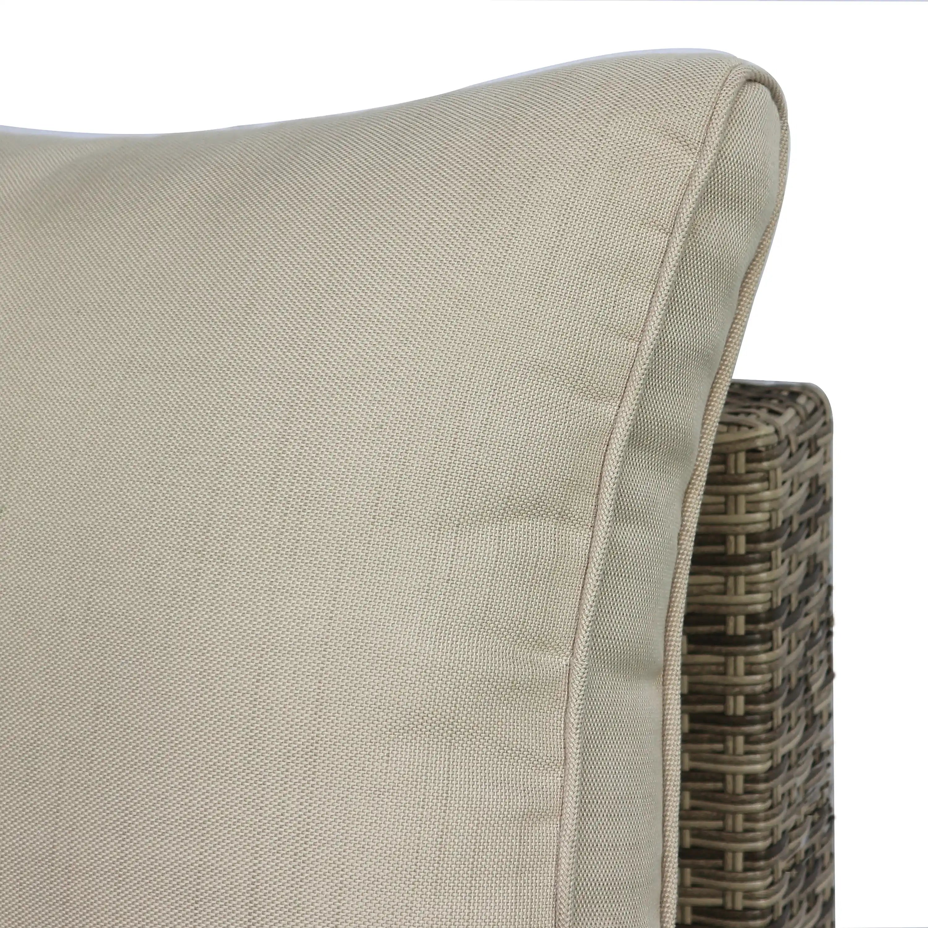 Outdoor patio sectional arm with light beige cushion and woven wicker side panel