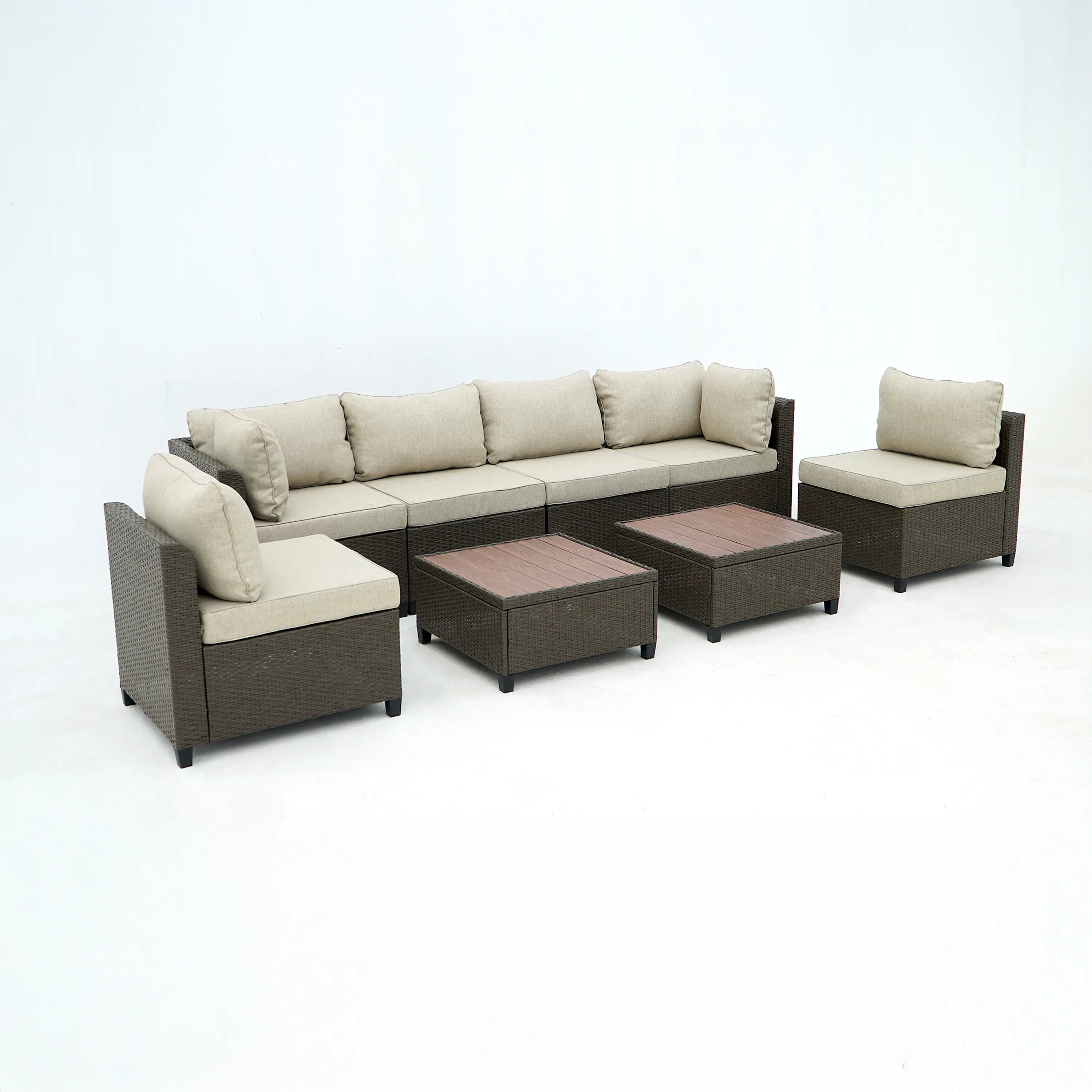 Outdoor wicker sectional sofa set with beige cushions and square ottoman tables