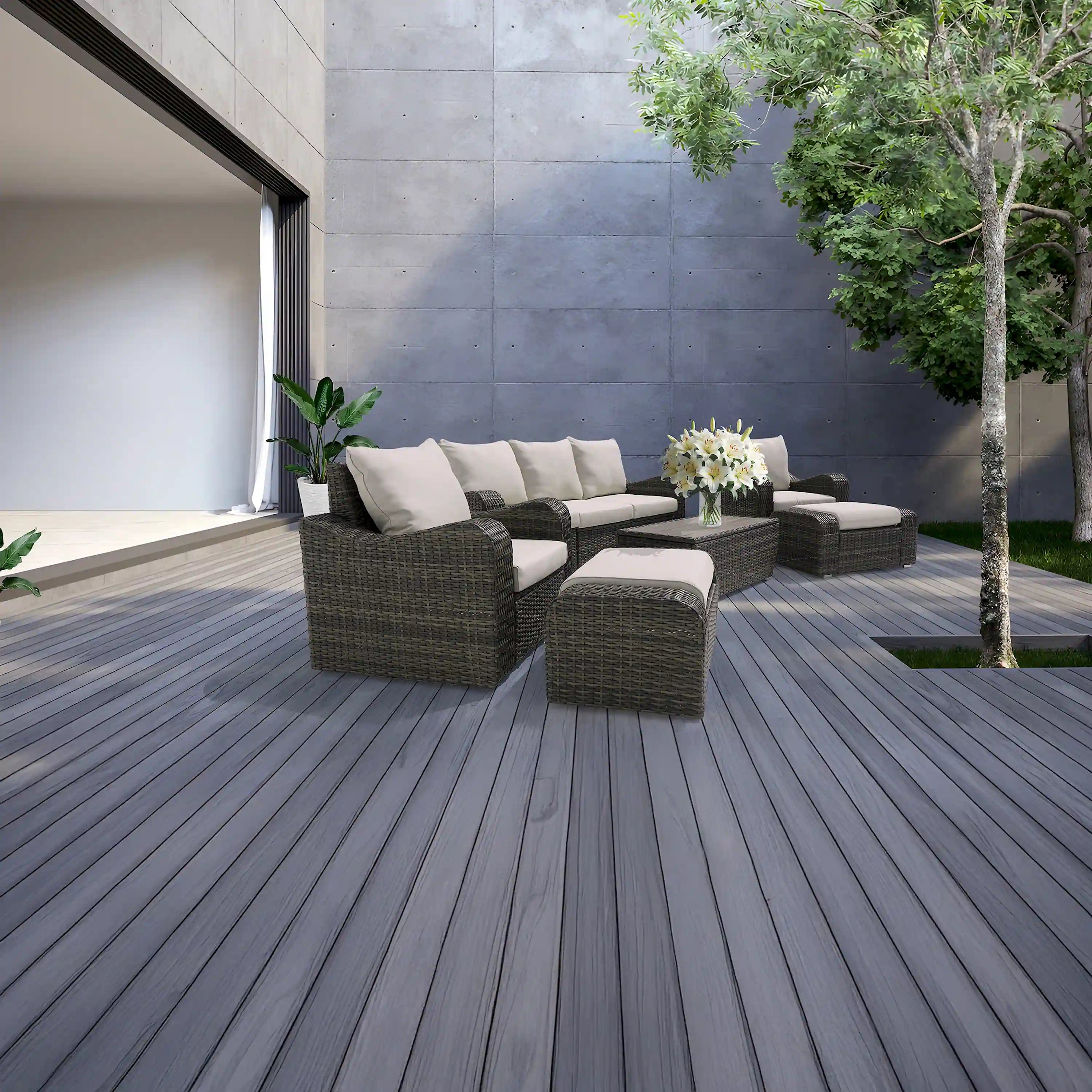 Brown outdoor wicker sofa and chairs with table, beige seat cushions and throw pillows