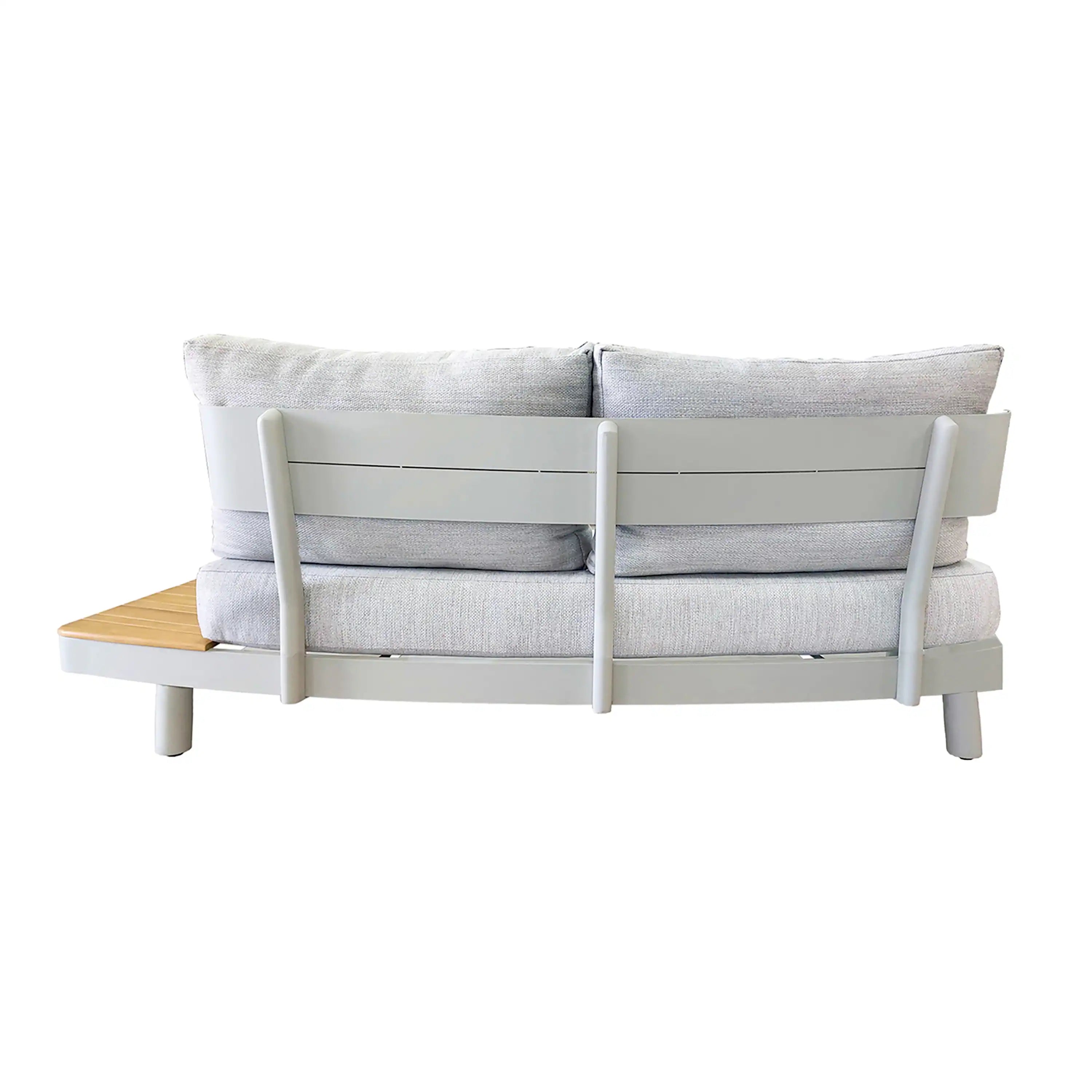 Outdoor sofa with cream cushions and white frame panels, paired with teak slat table.
