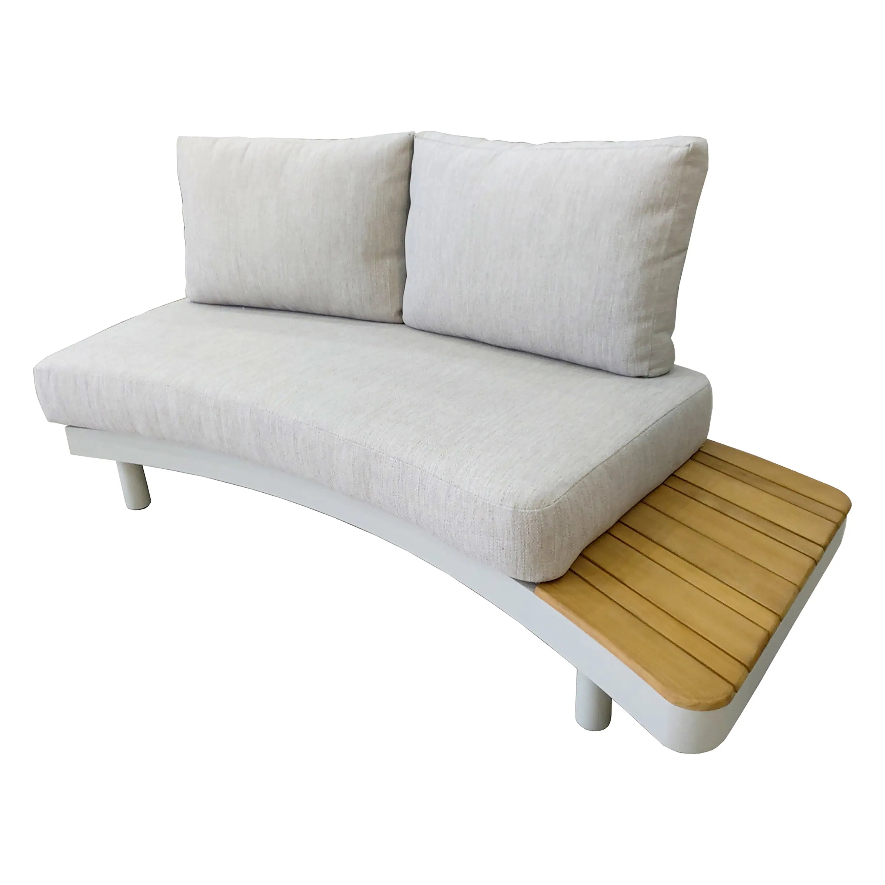 Outdoor corner sectional sofa with cream cushions and teak slat base on white legs.