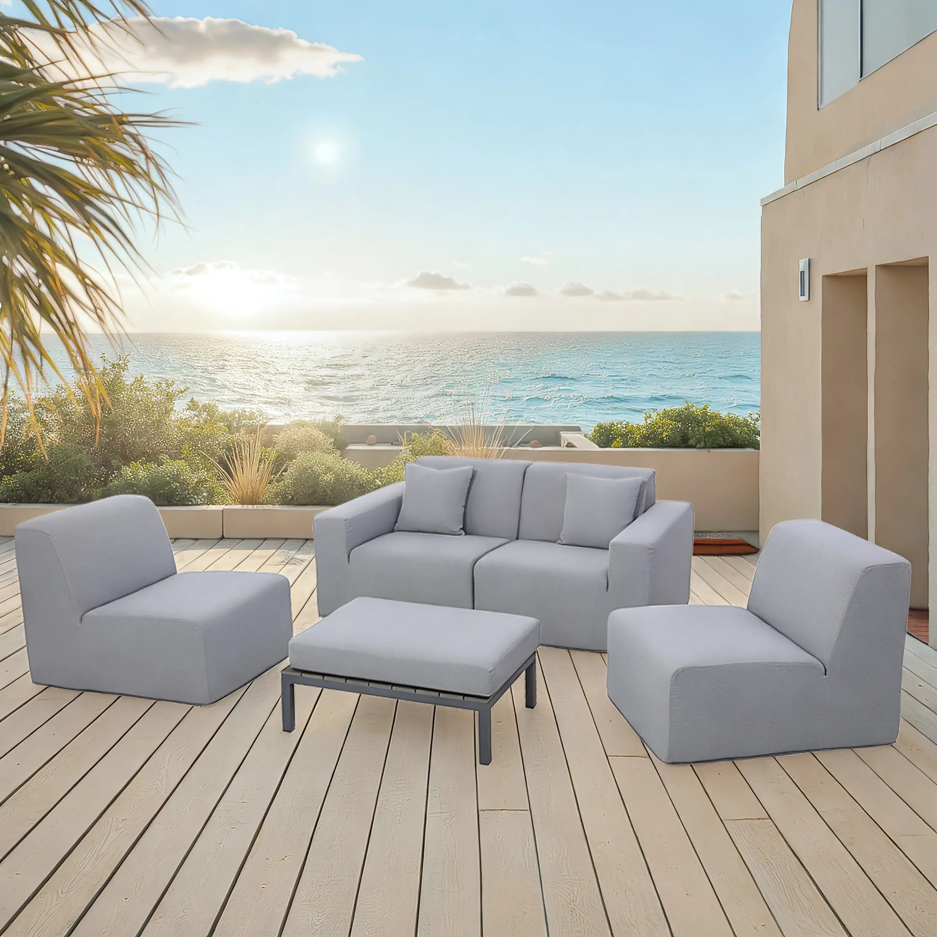 Gray outdoor seating set with two chairs, sectional sofa, and center ottoman