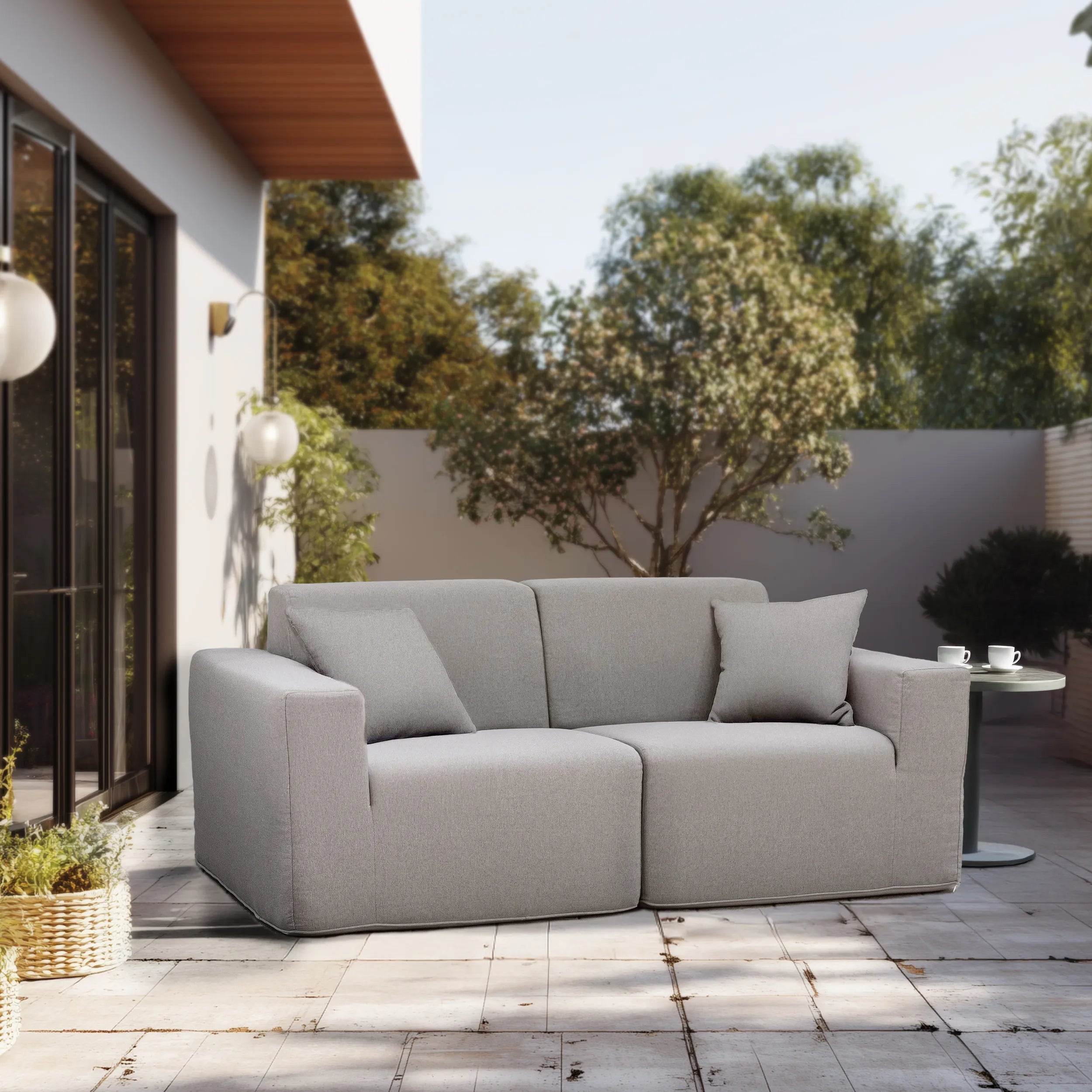 Gray outdoor 2-piece sectional sofa set with back pillows and two-seat configuration