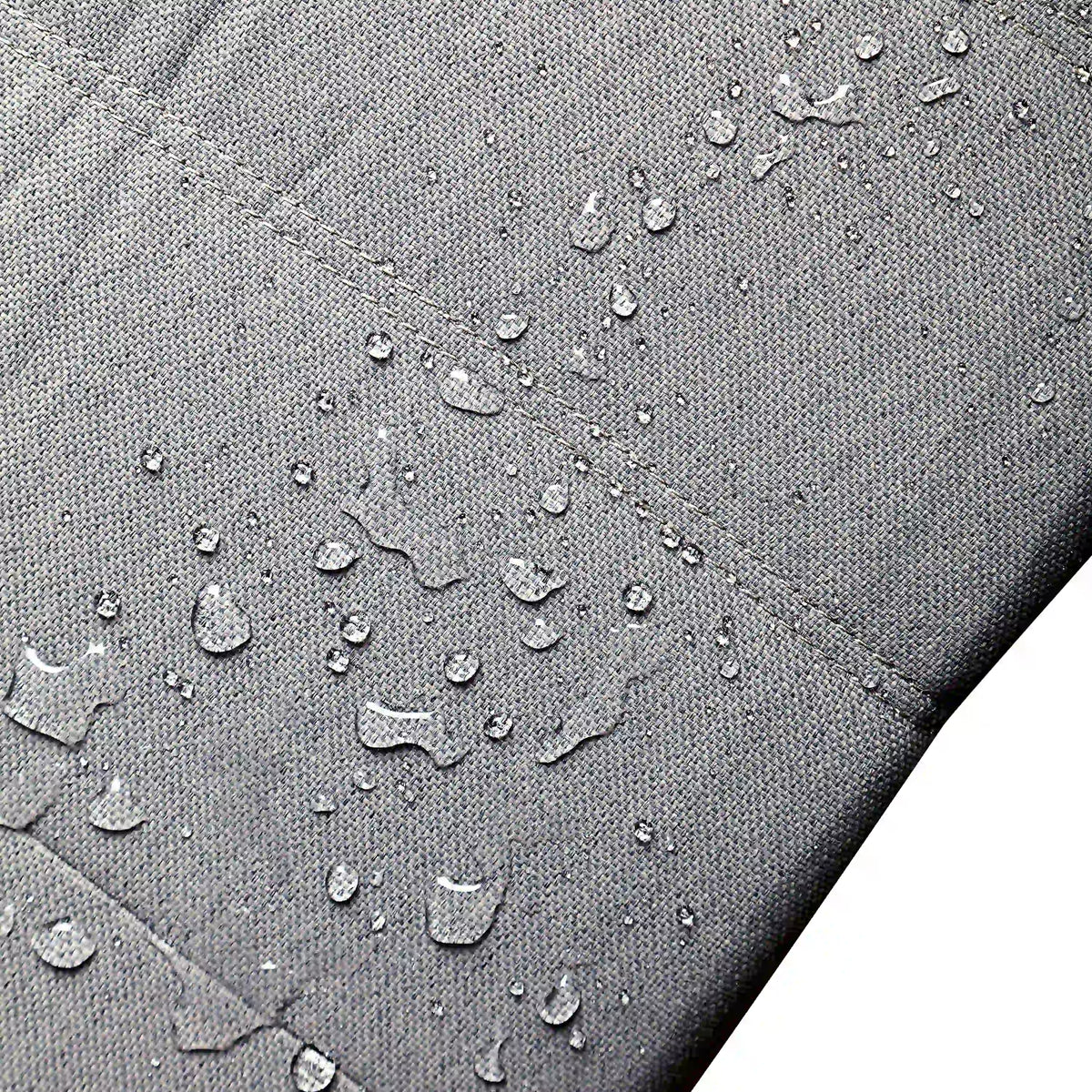 Gray outdoor foam ottoman top fabric with water droplets for spill resistance