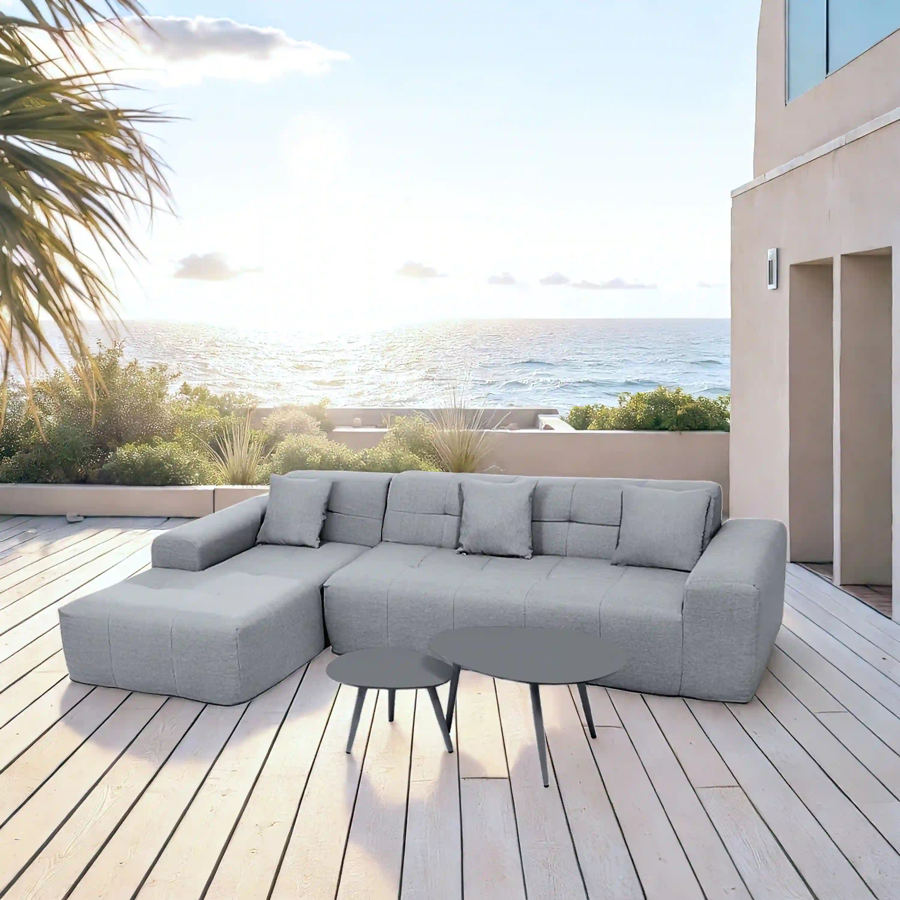 Gray outdoor sectional sofa set with chaise sections and round side table