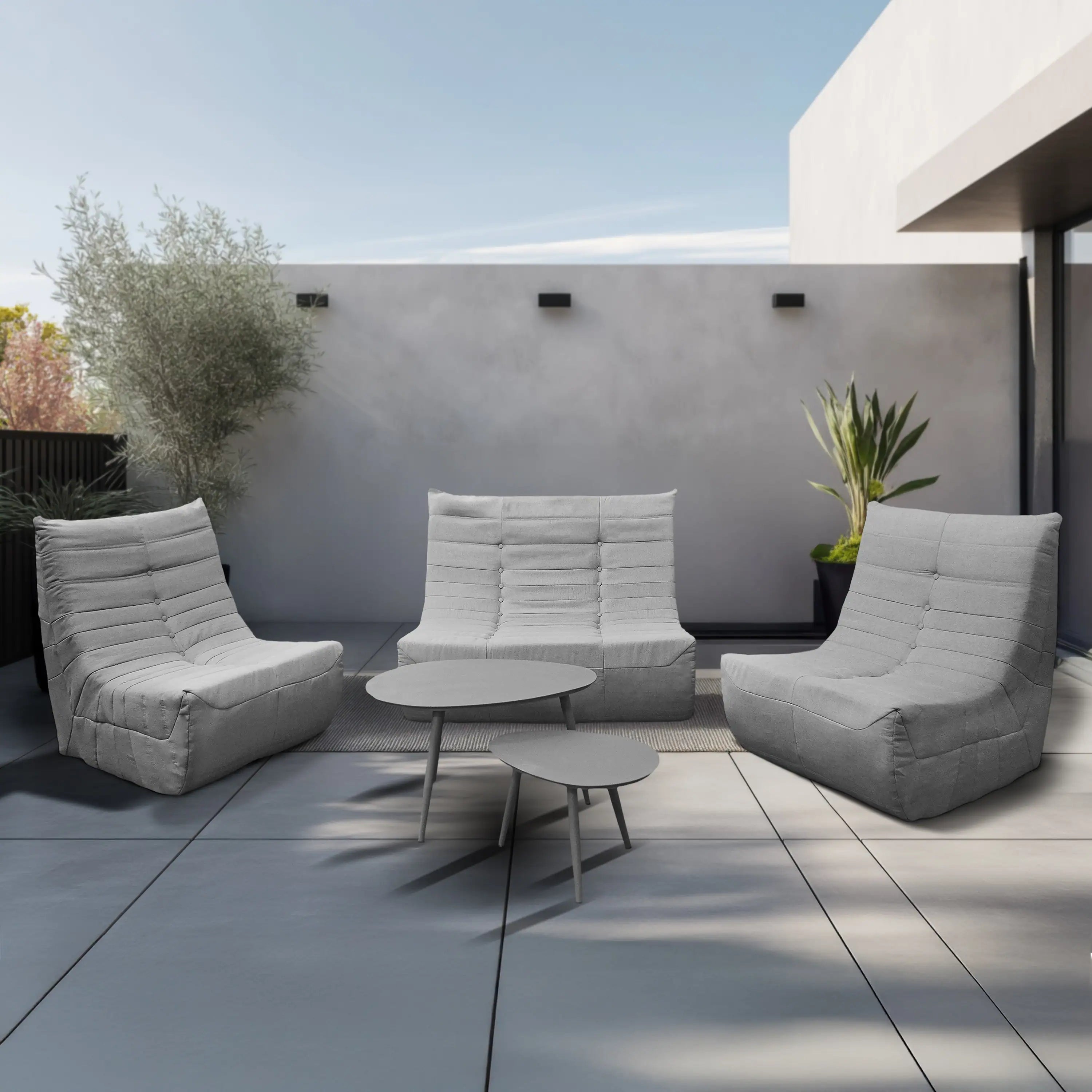 Gray outdoor seating set with loveseat and two chairs, plus round tables