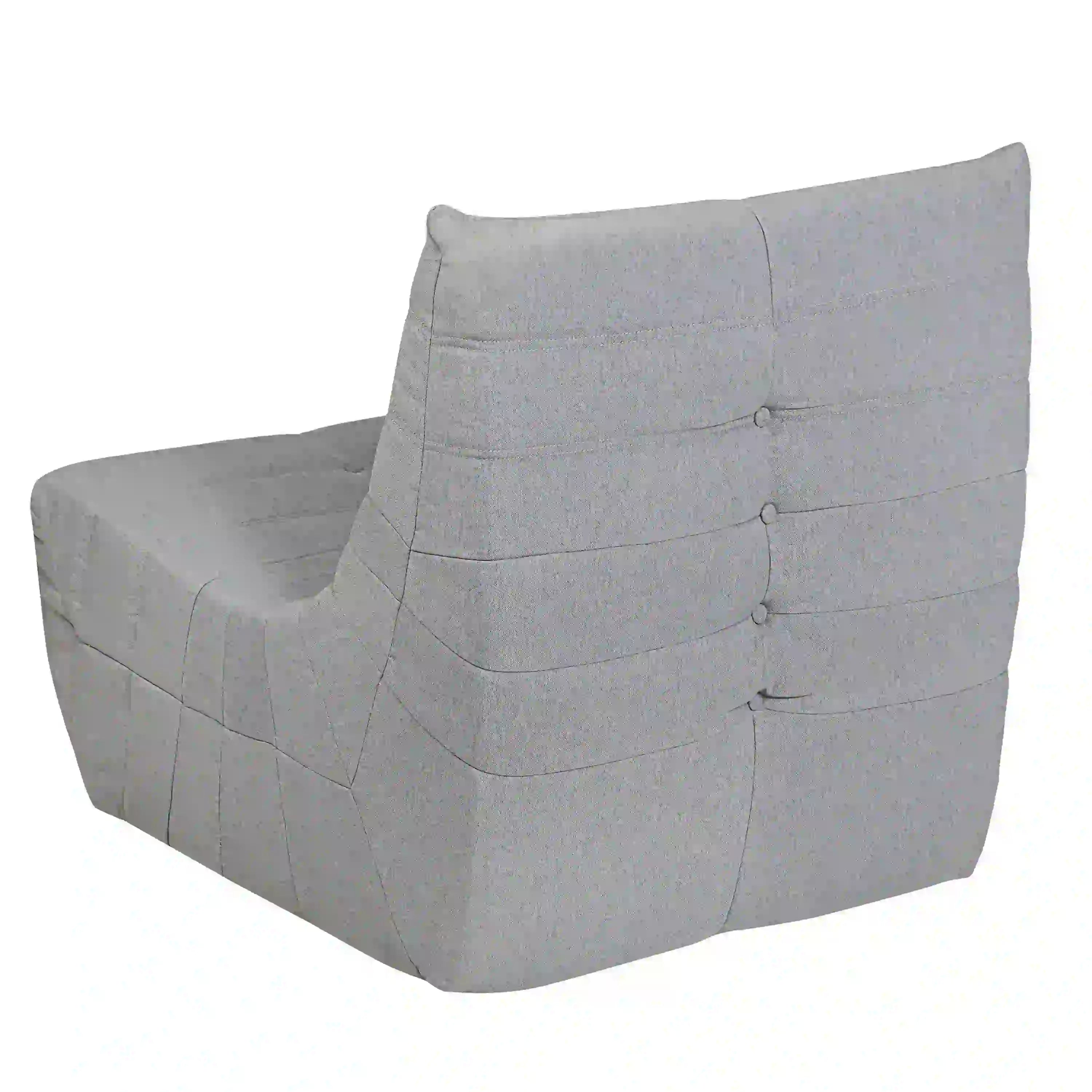 Gray chair side view with padded armrests and button-tufted horizontal back straps