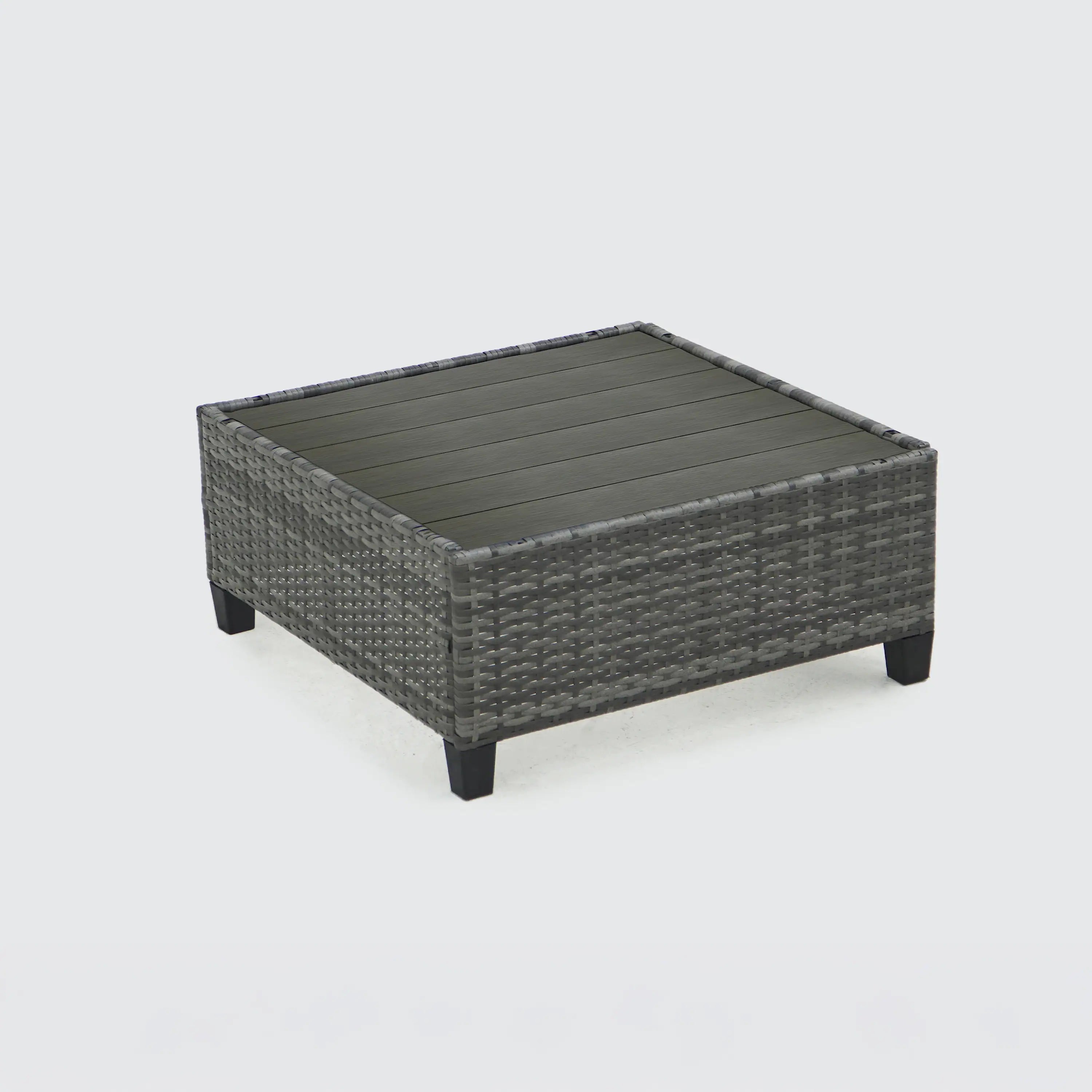 Gray outdoor wicker ottoman with dark feet and flat cushion top