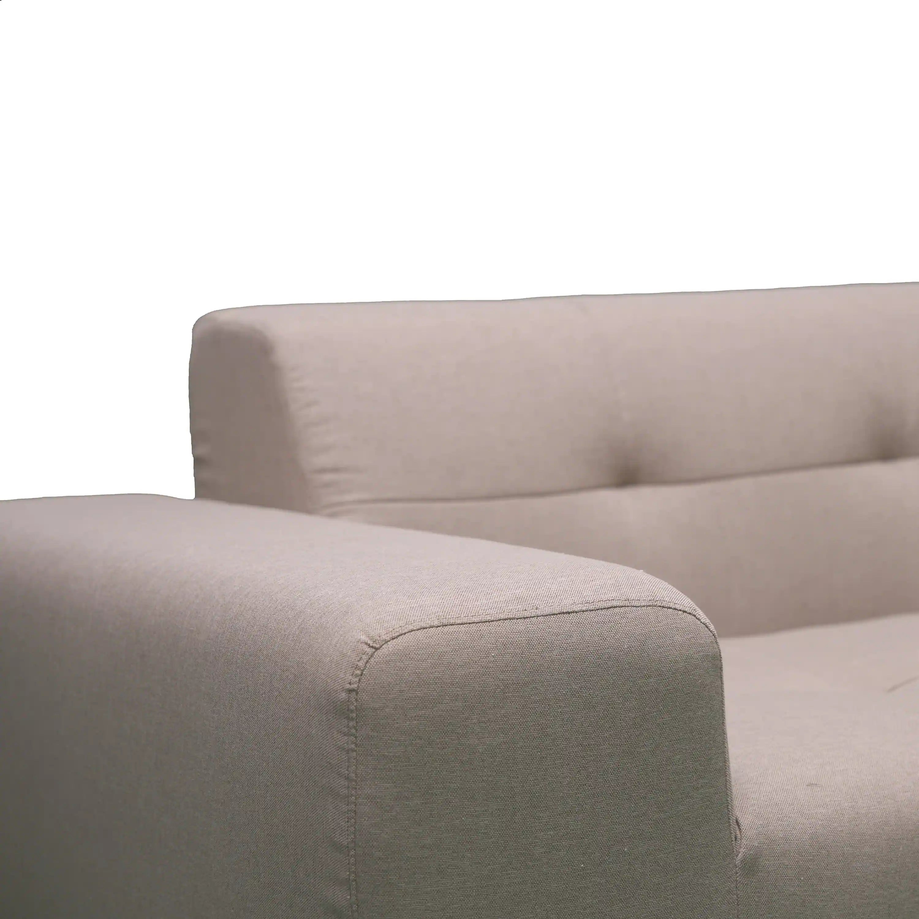 Tan outdoor sectional armrest and seat cushion with stitched seam details