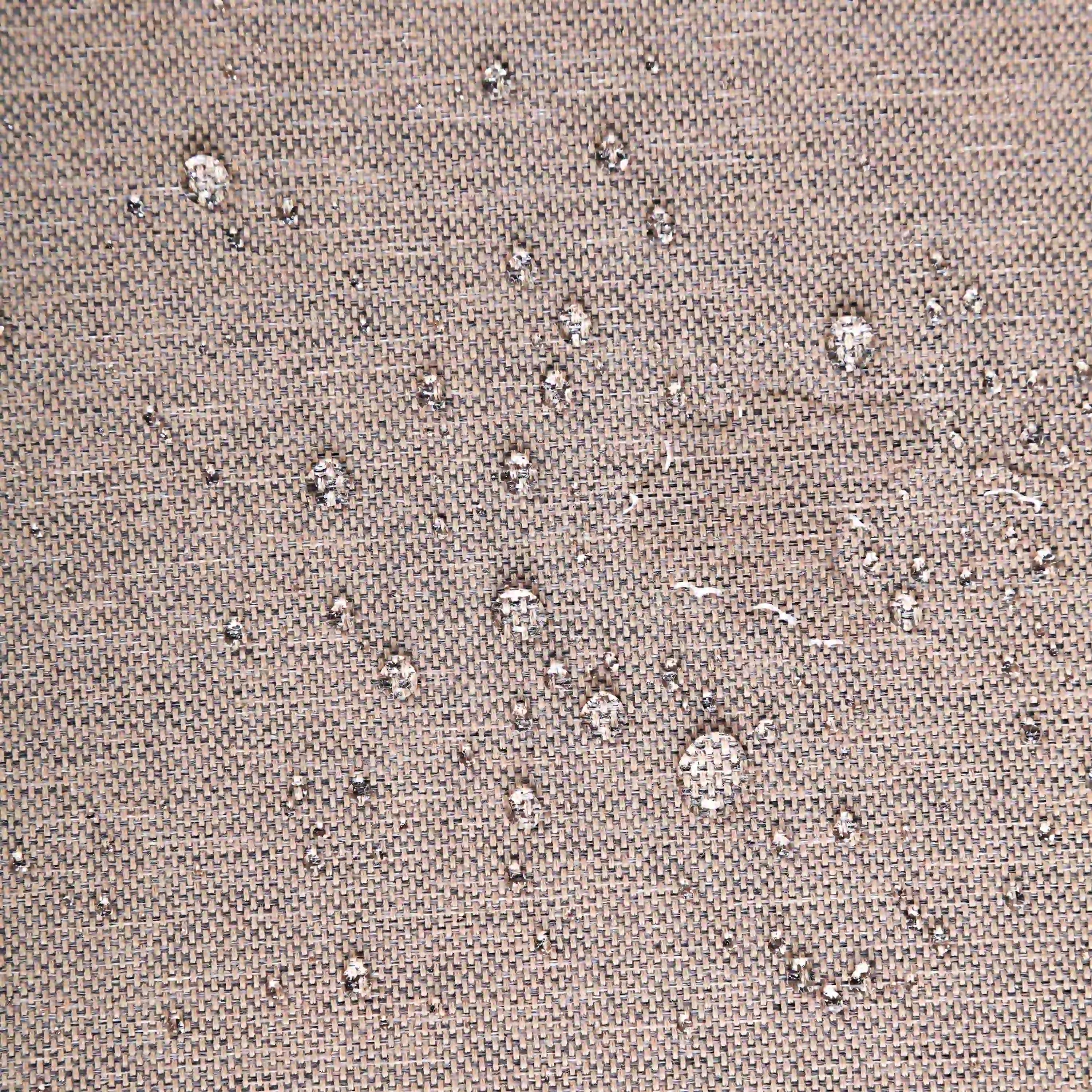 Tan woven outdoor fabric texture with small speckled pattern