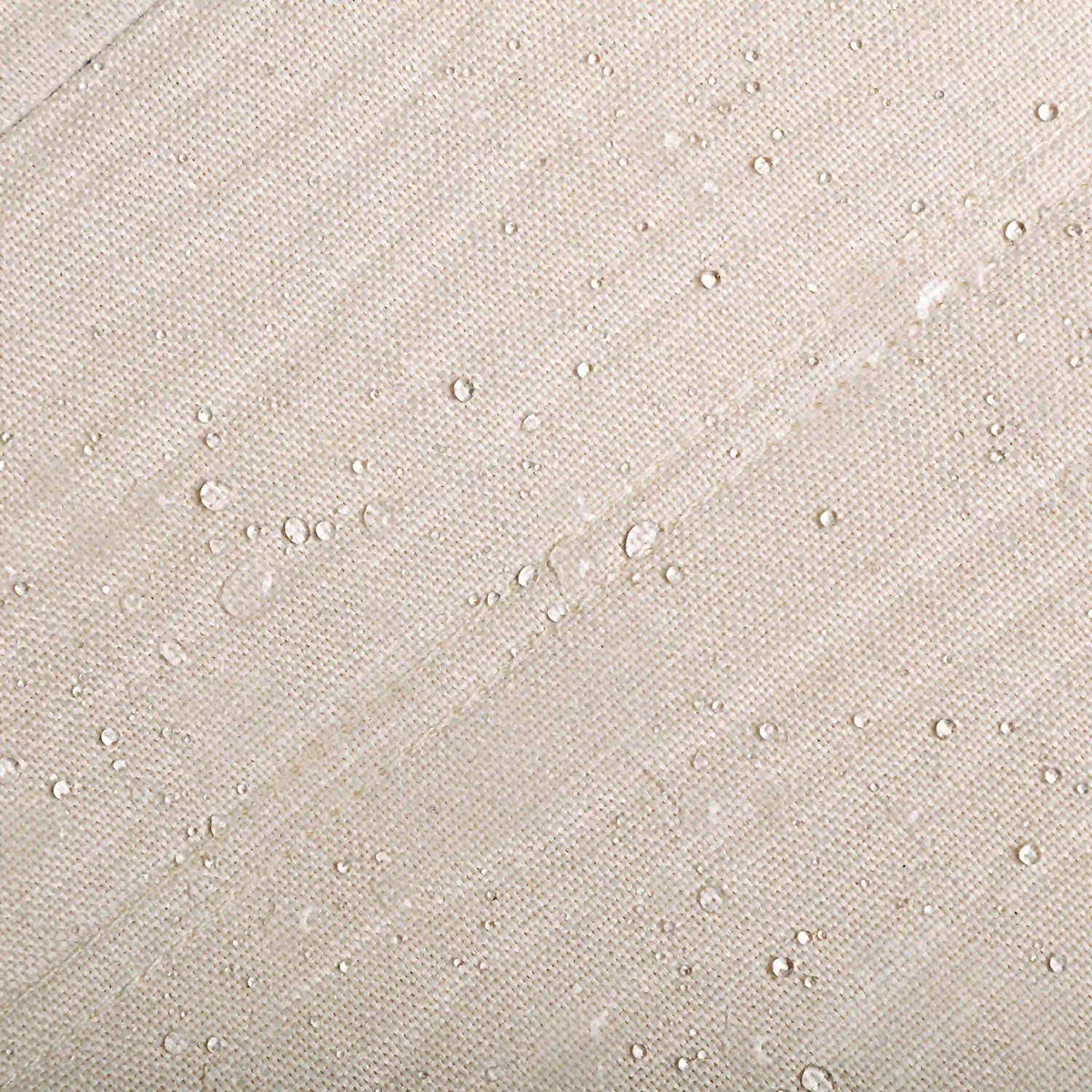Beige outdoor fabric with water droplets, textured speckled weave