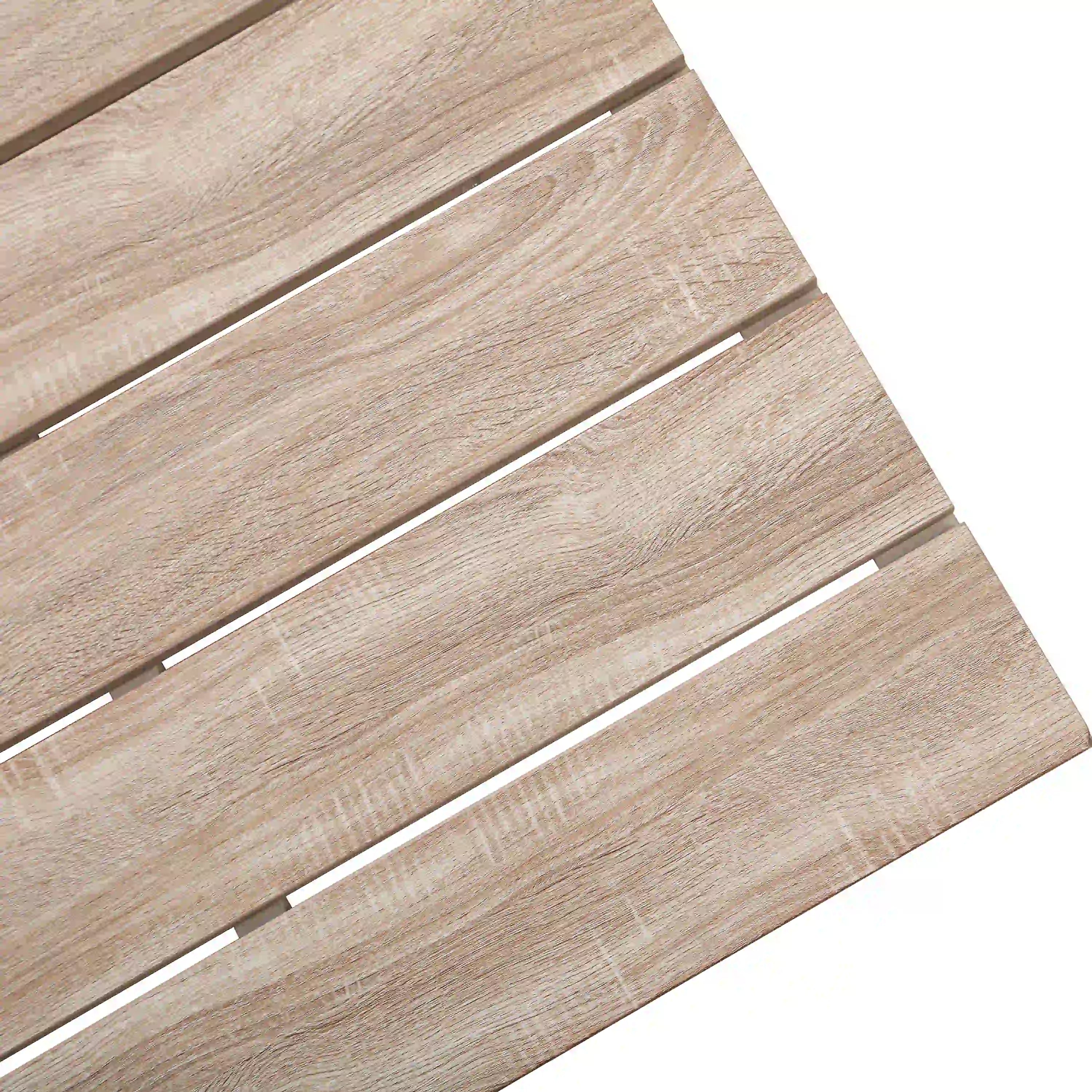 Close-up of light wood slat tabletop on an outdoor ottoman table frame