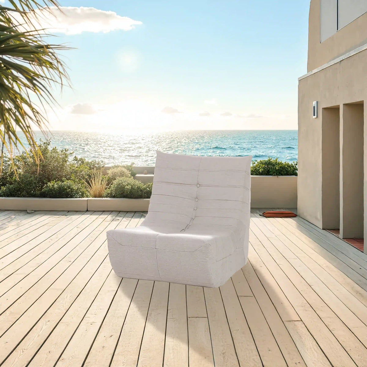 Beige outdoor foam loveseat chair with tufted backrest and curved seat base