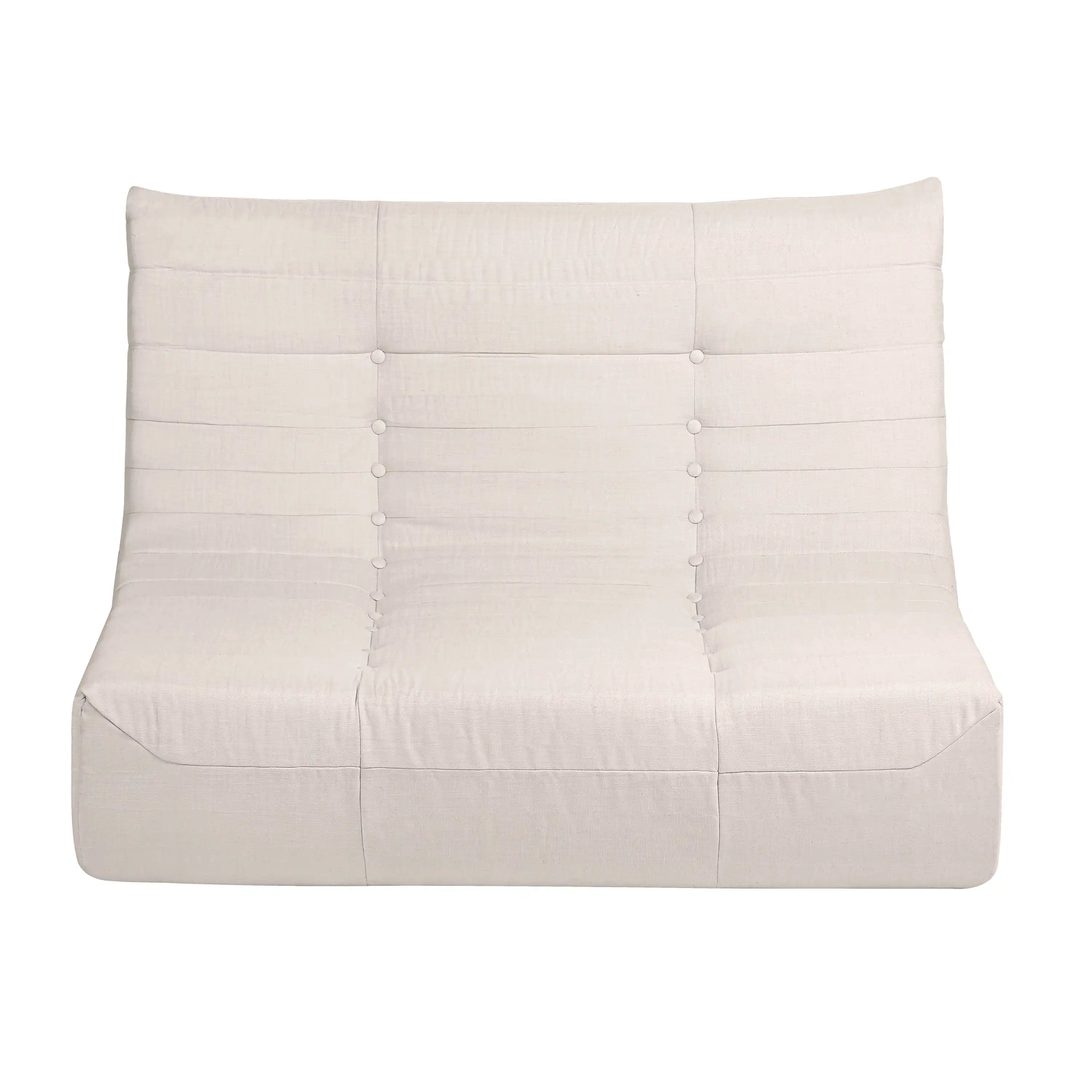 Beige outdoor compressed foam sofa with tufted back and round button details