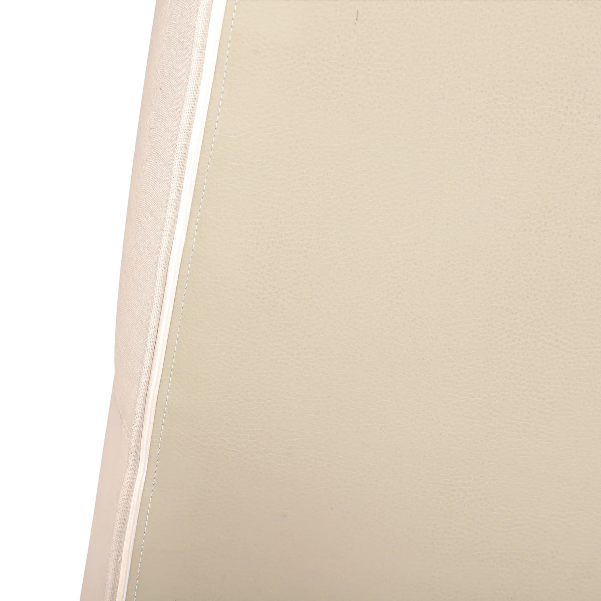 Beige sofa seat cushion with stitched piping along the edge