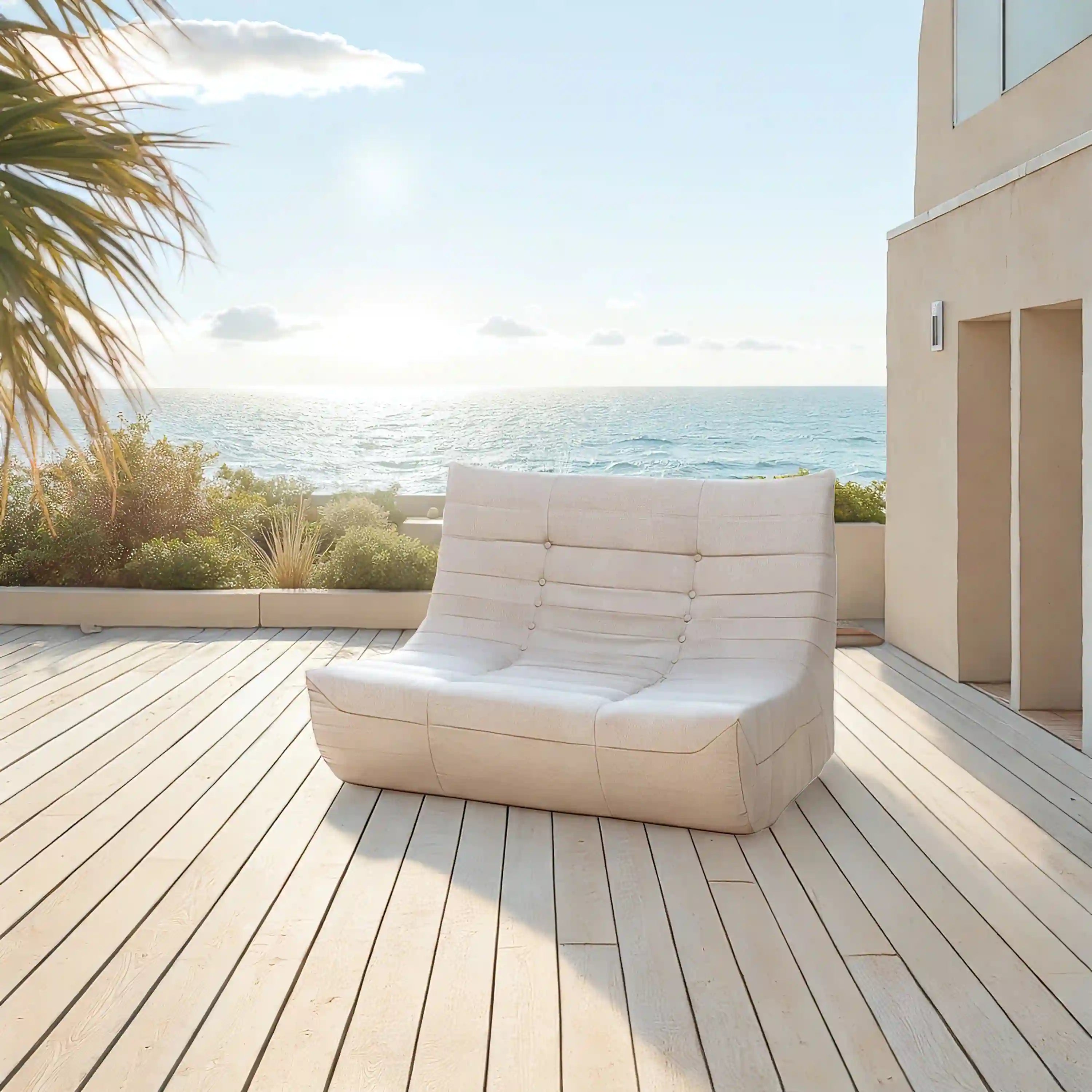 Beige outdoor compressed foam sofa with tufted back and button details