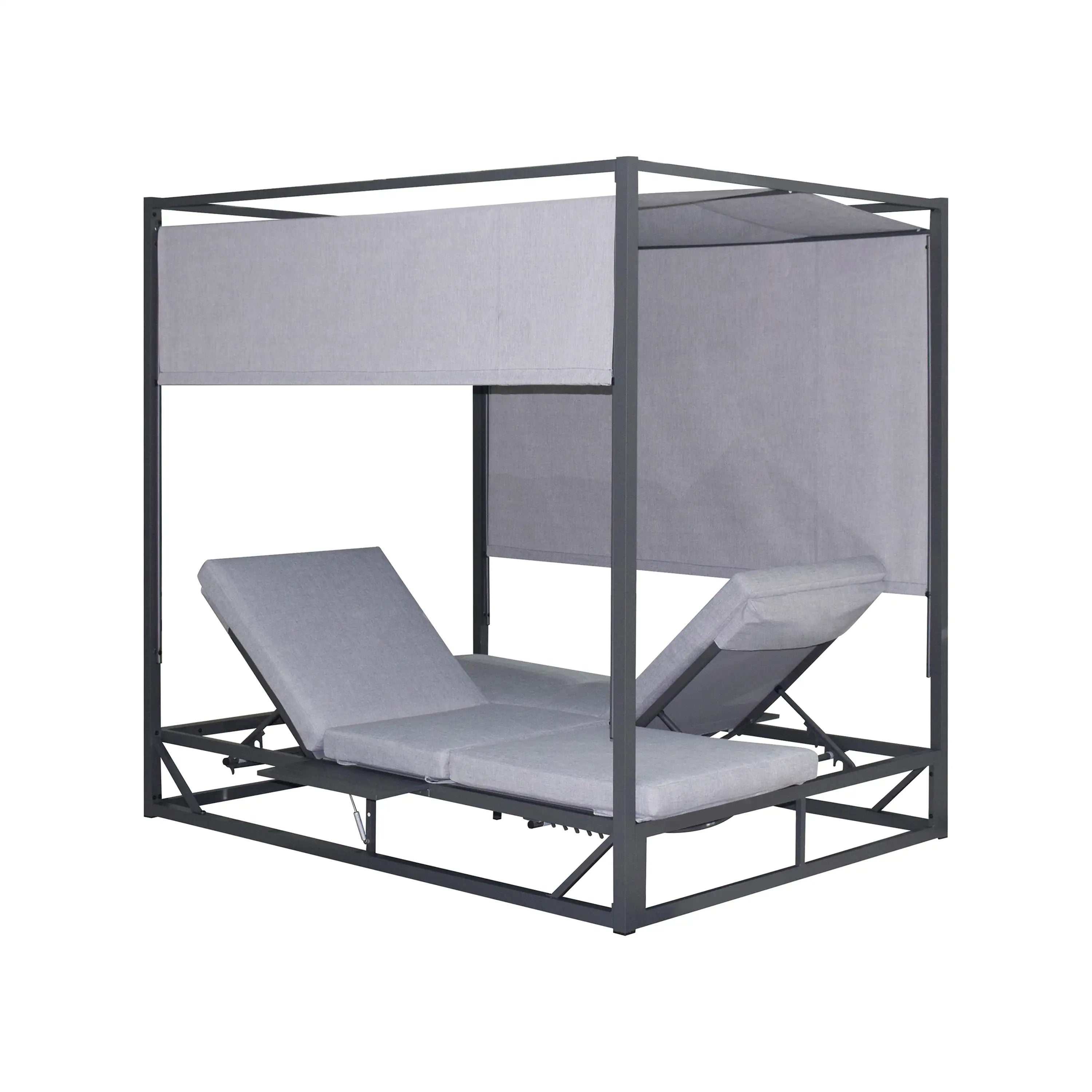 Gray outdoor patio daybed with canopy panels and slatted metal base, corner view
