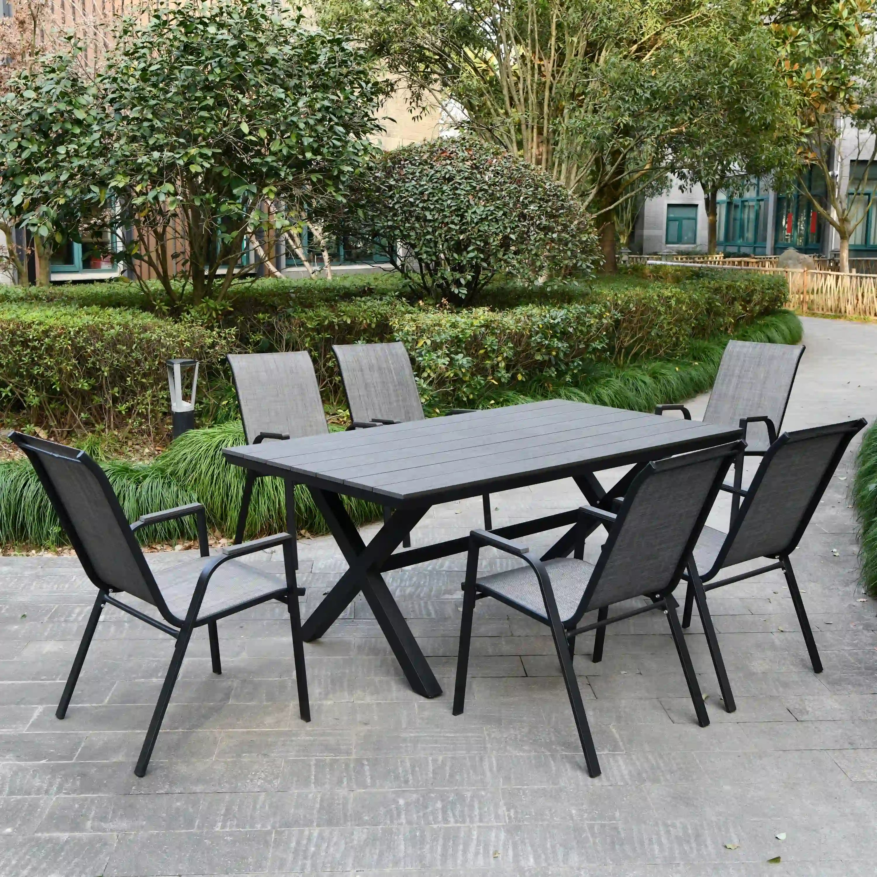 Outdoor patio dining set with black table and gray woven chairs