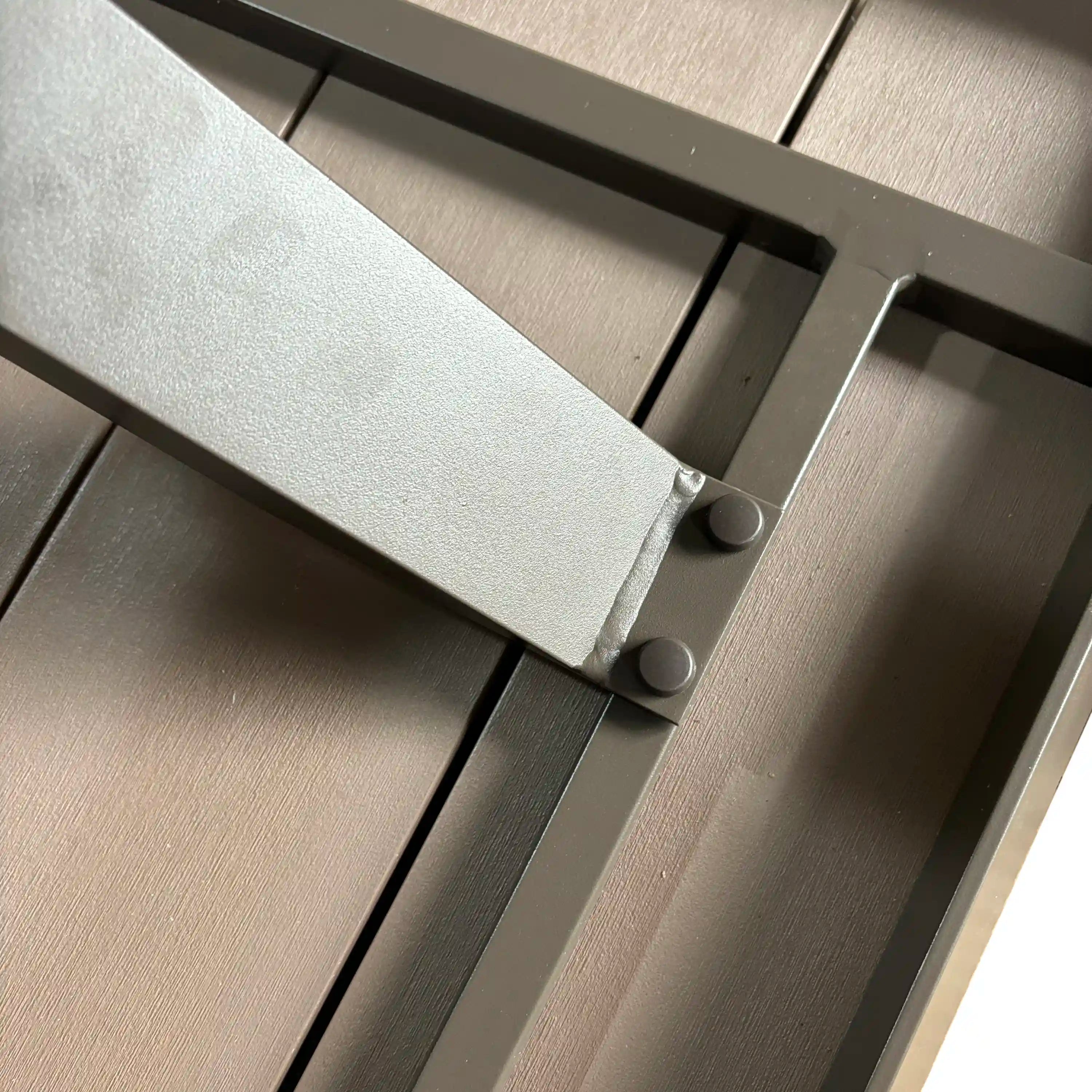 Square table corner with dark metal support bars and fastener bolts