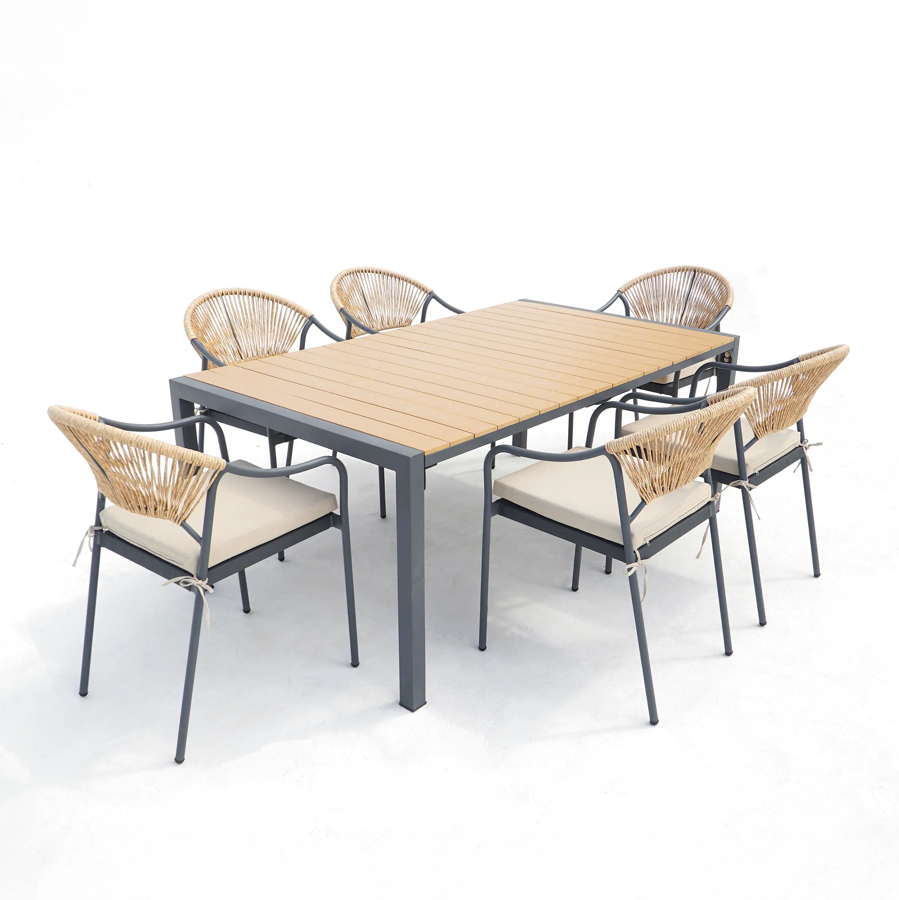 Outdoor dining table set with rectangular wood-slat table and six wicker chairs, beige cushions.