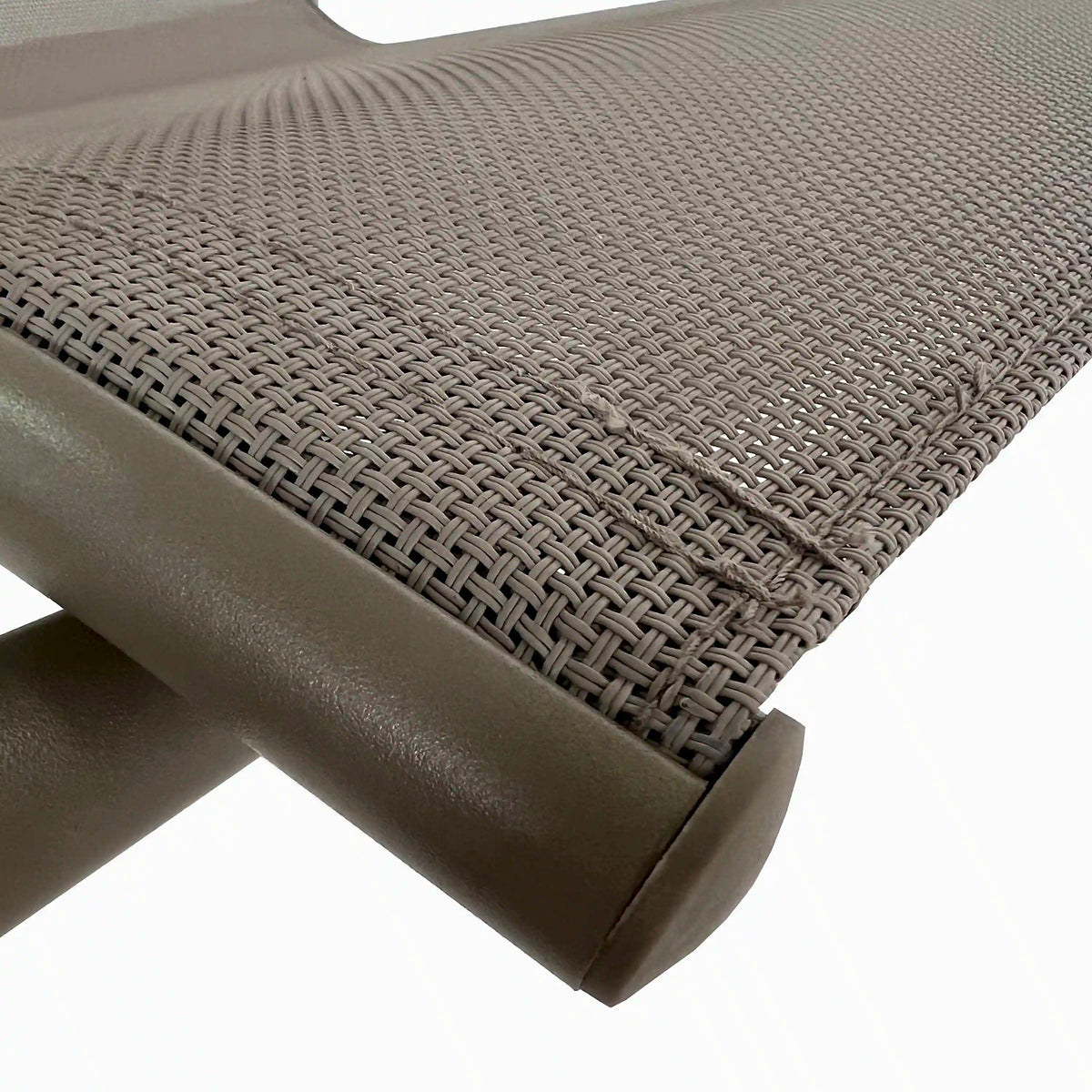 Close-up of dark woven mesh patio chair seat with metal frame and arm detail